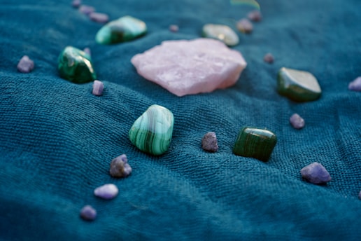 A close up of rocks and stones on a blue surface
