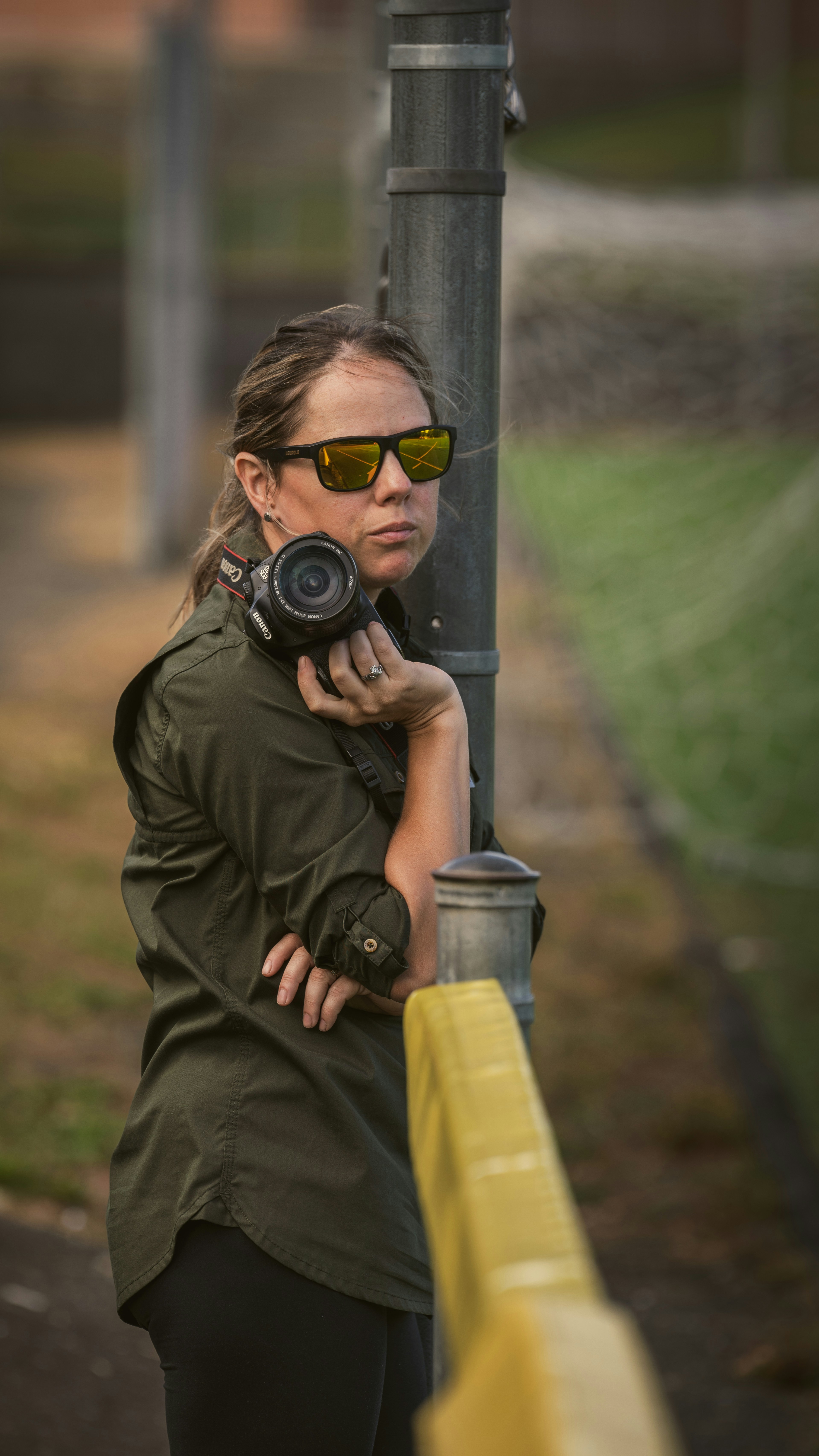 A woman taking a picture of herself with a camera