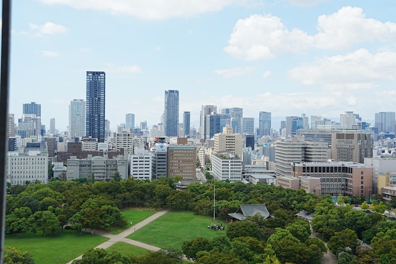 Kitakyushu cityscape, high-rise apartment building, urban residential tower, Japanese apartment complex, city skyline