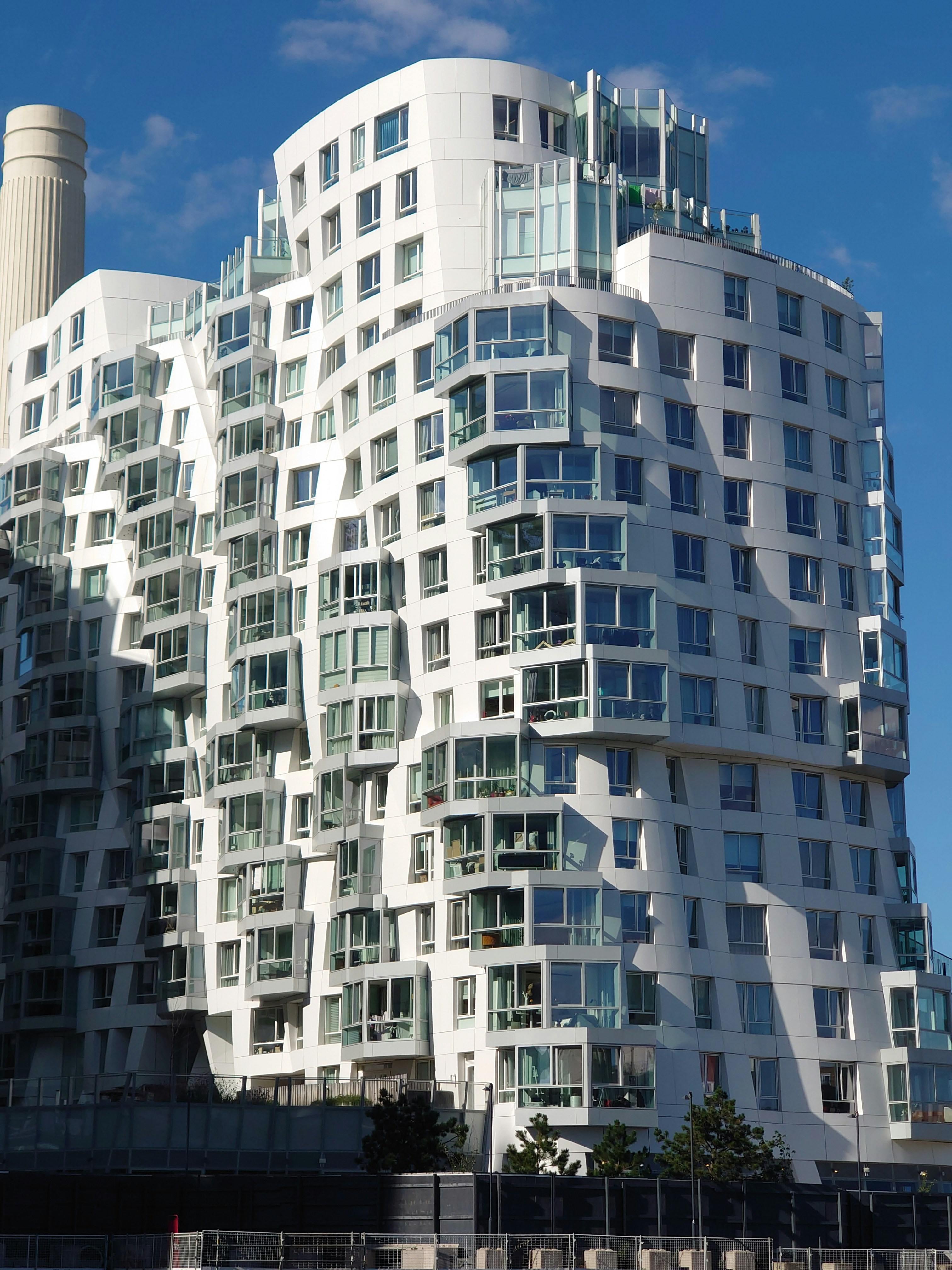 A tall white building with lots of windows