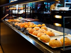 A display case filled with lots of pastries
