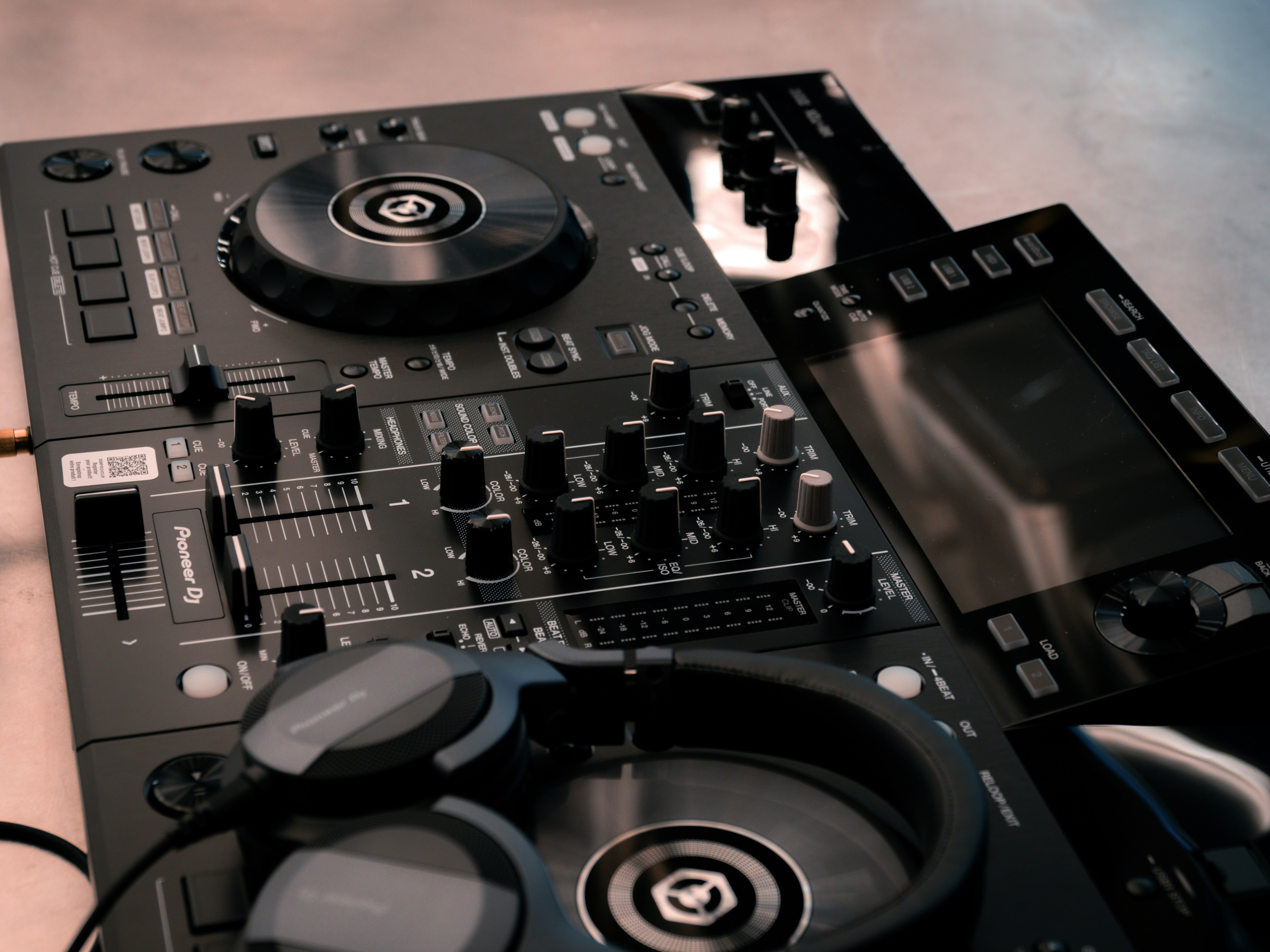 A pair of dj controllers sitting on top of a table photo – Free Music ...