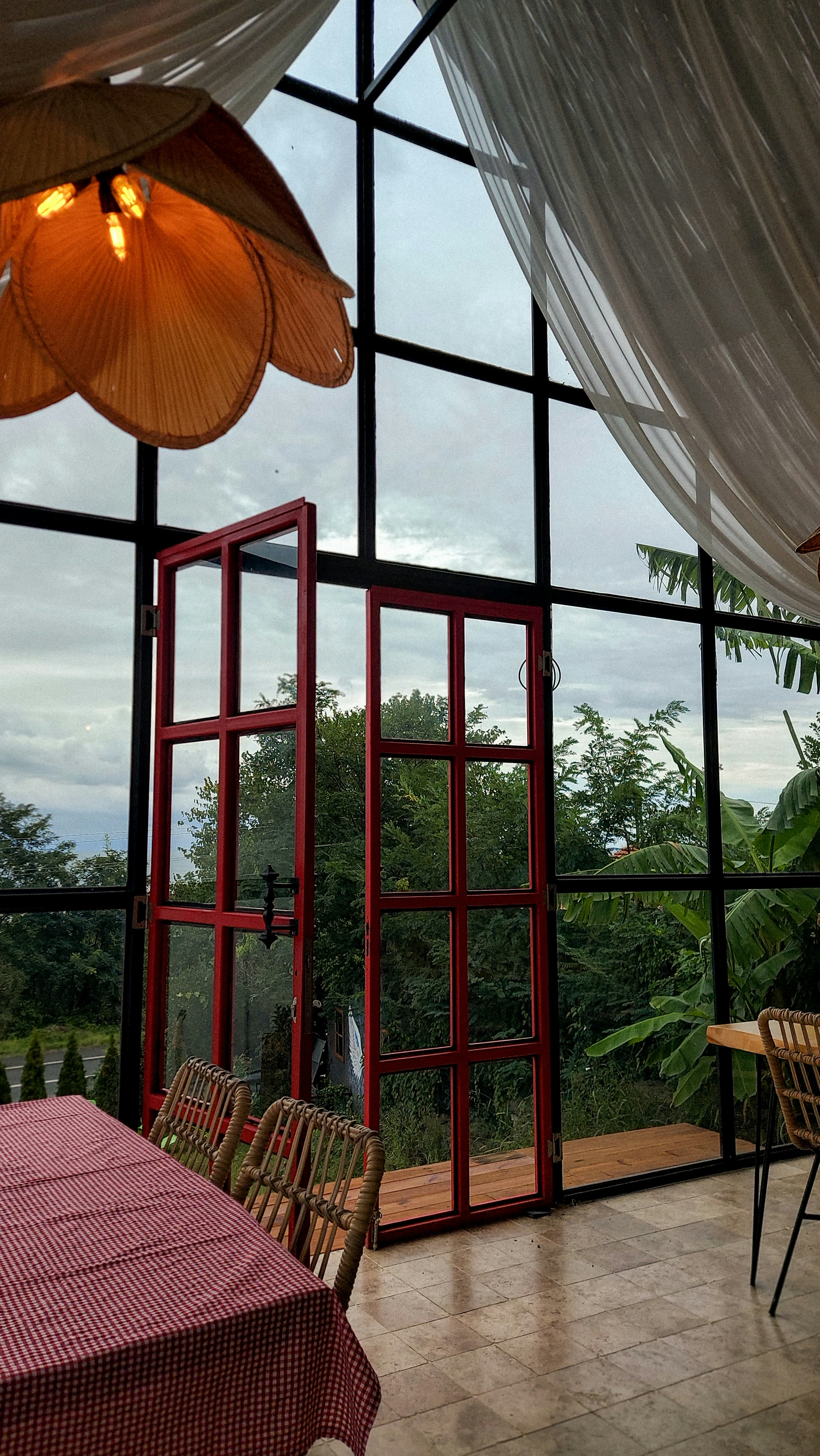 A dining room with a view of the outdoors