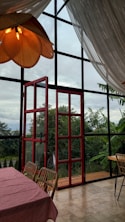 A dining room with a view of the outdoors