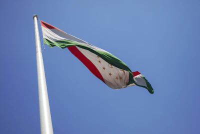 A flag flying in the wind on a clear day