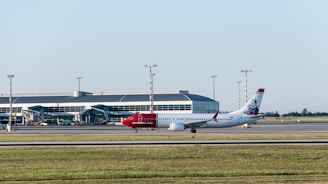 A large jetliner sitting on top of an airport runway