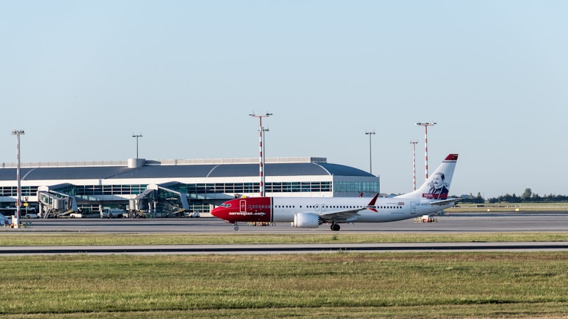 A large jetliner sitting on top of an airport runway