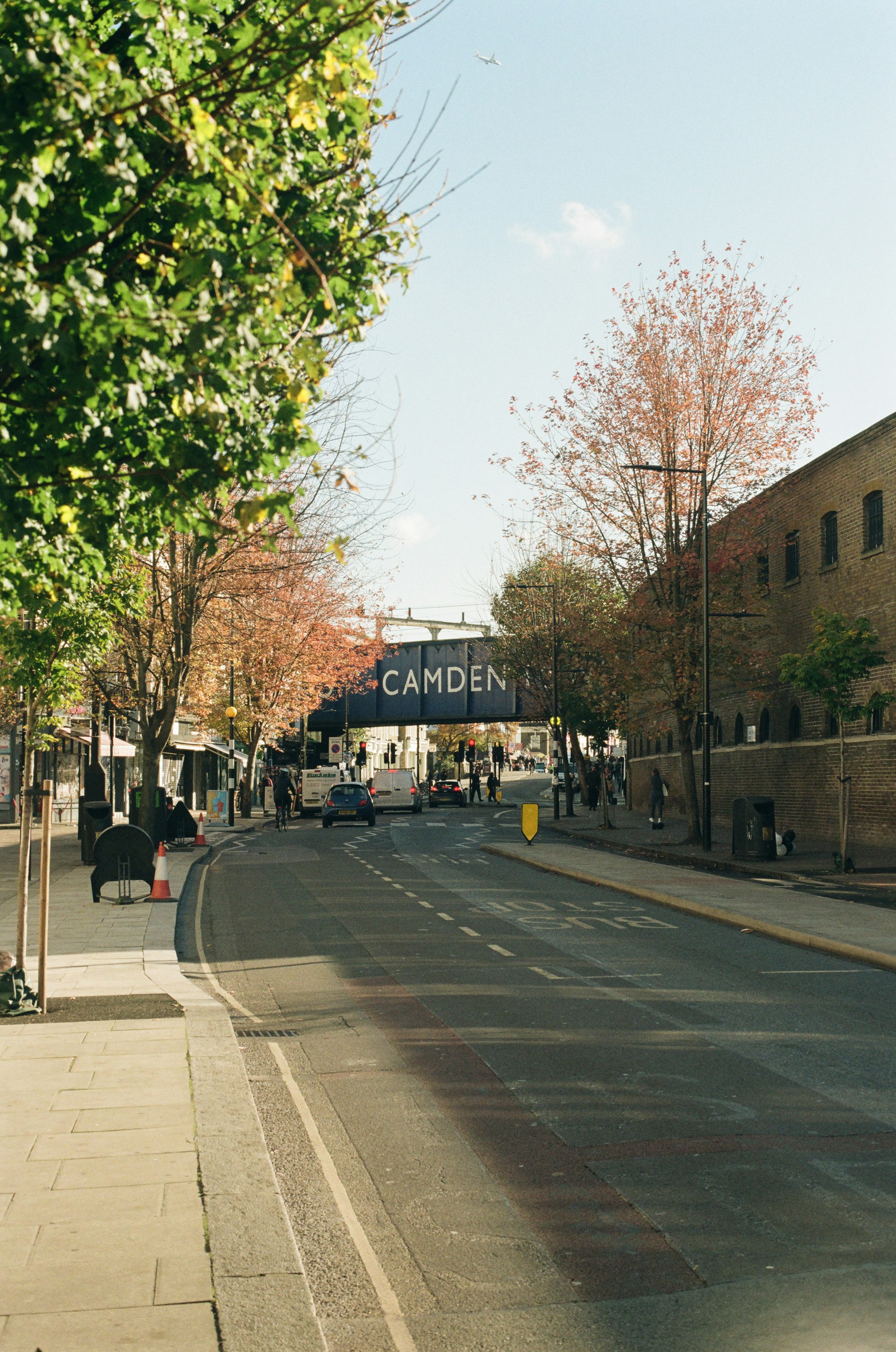 An empty street with a sign on the side of it