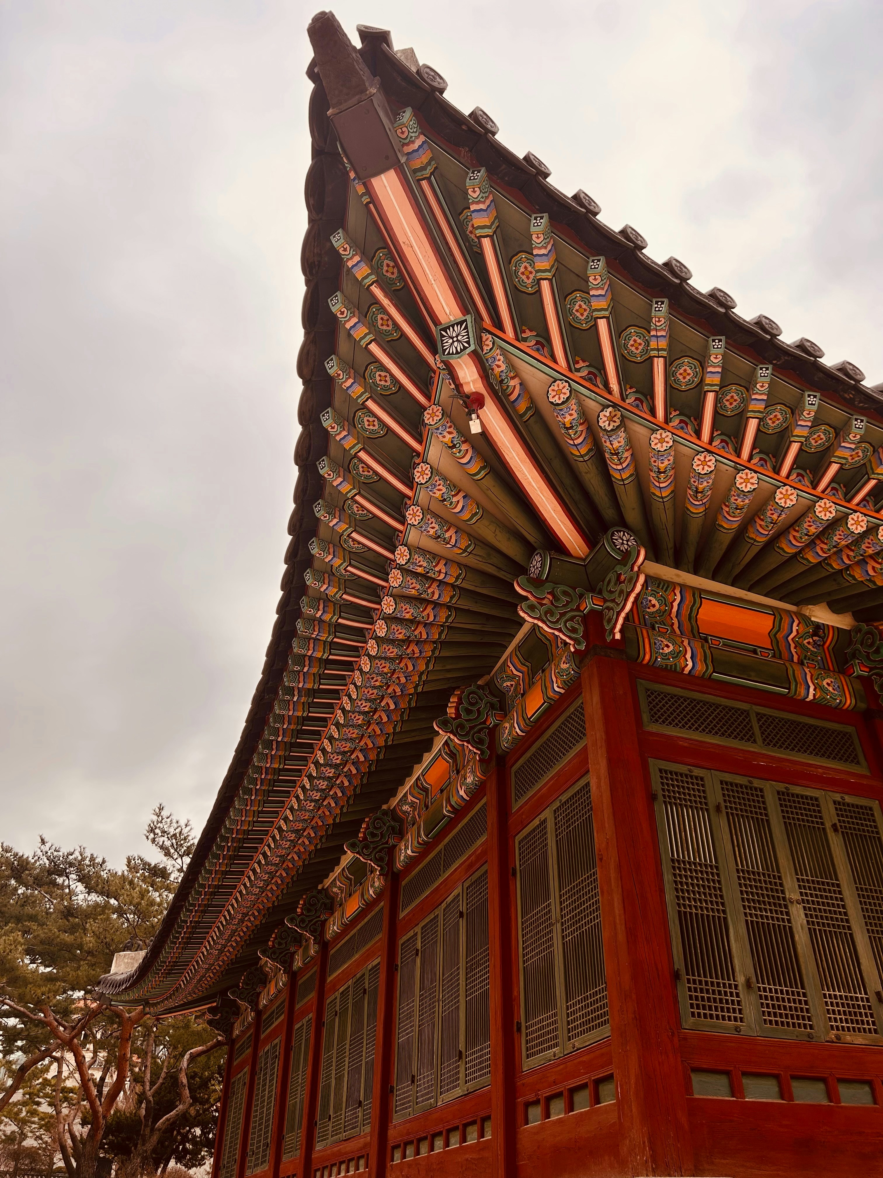 A tall building with a roof made of wood