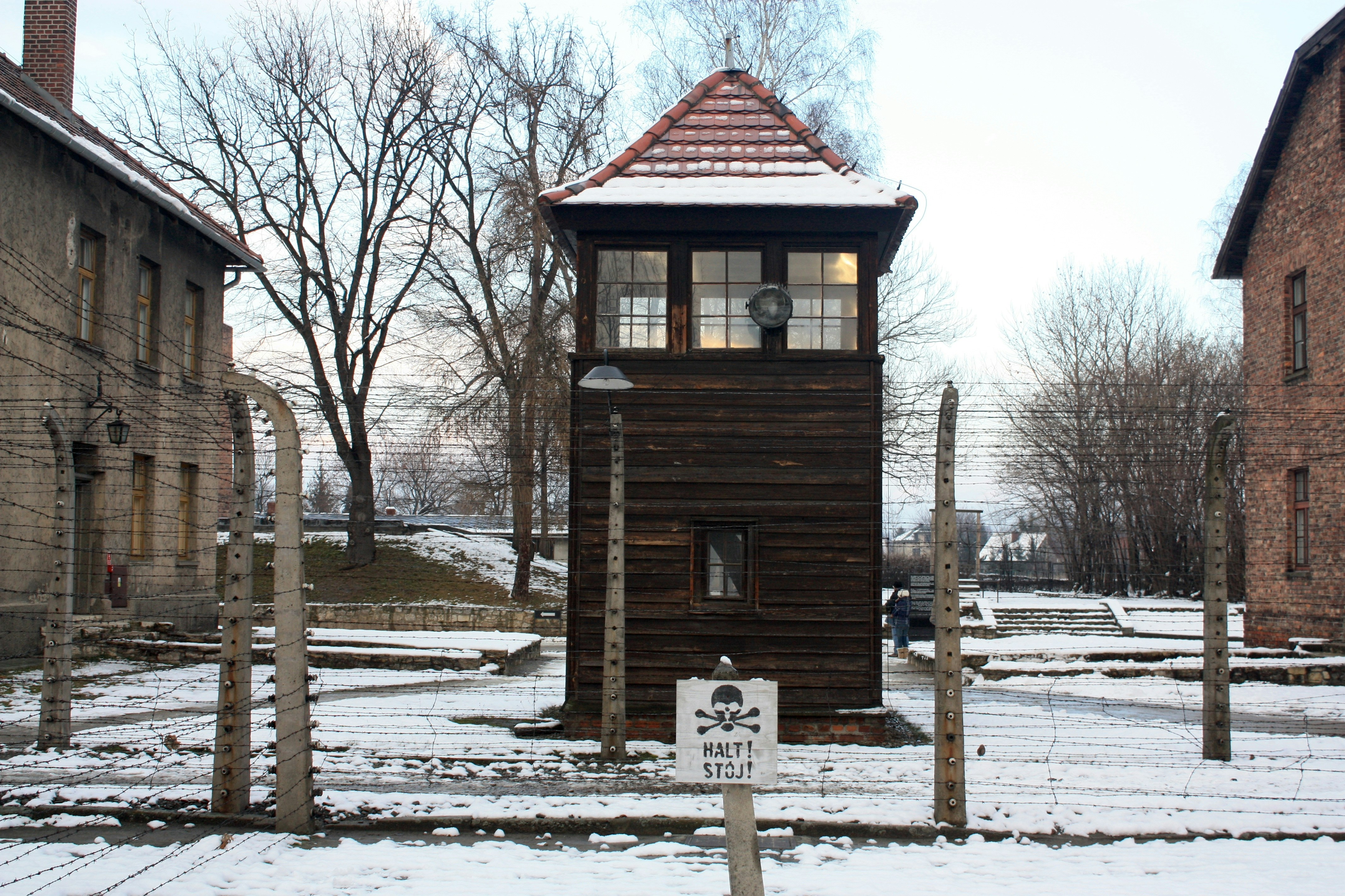 A small wooden tower sitting in the middle of a snow covered field