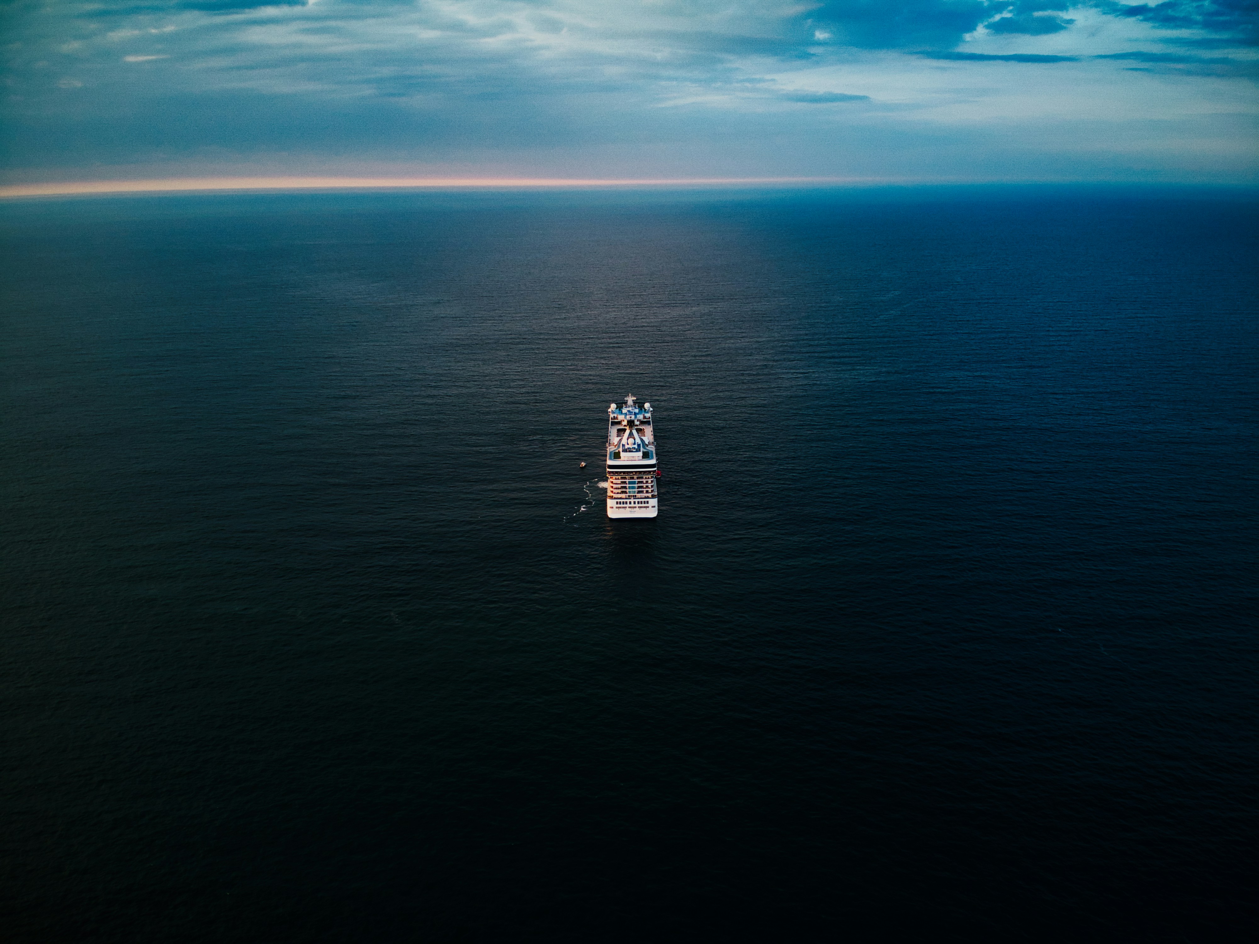 A large boat floating on top of a large body of water