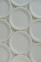 A group of white plates sitting on top of each other