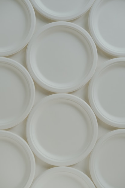 A group of white plates sitting on top of each other