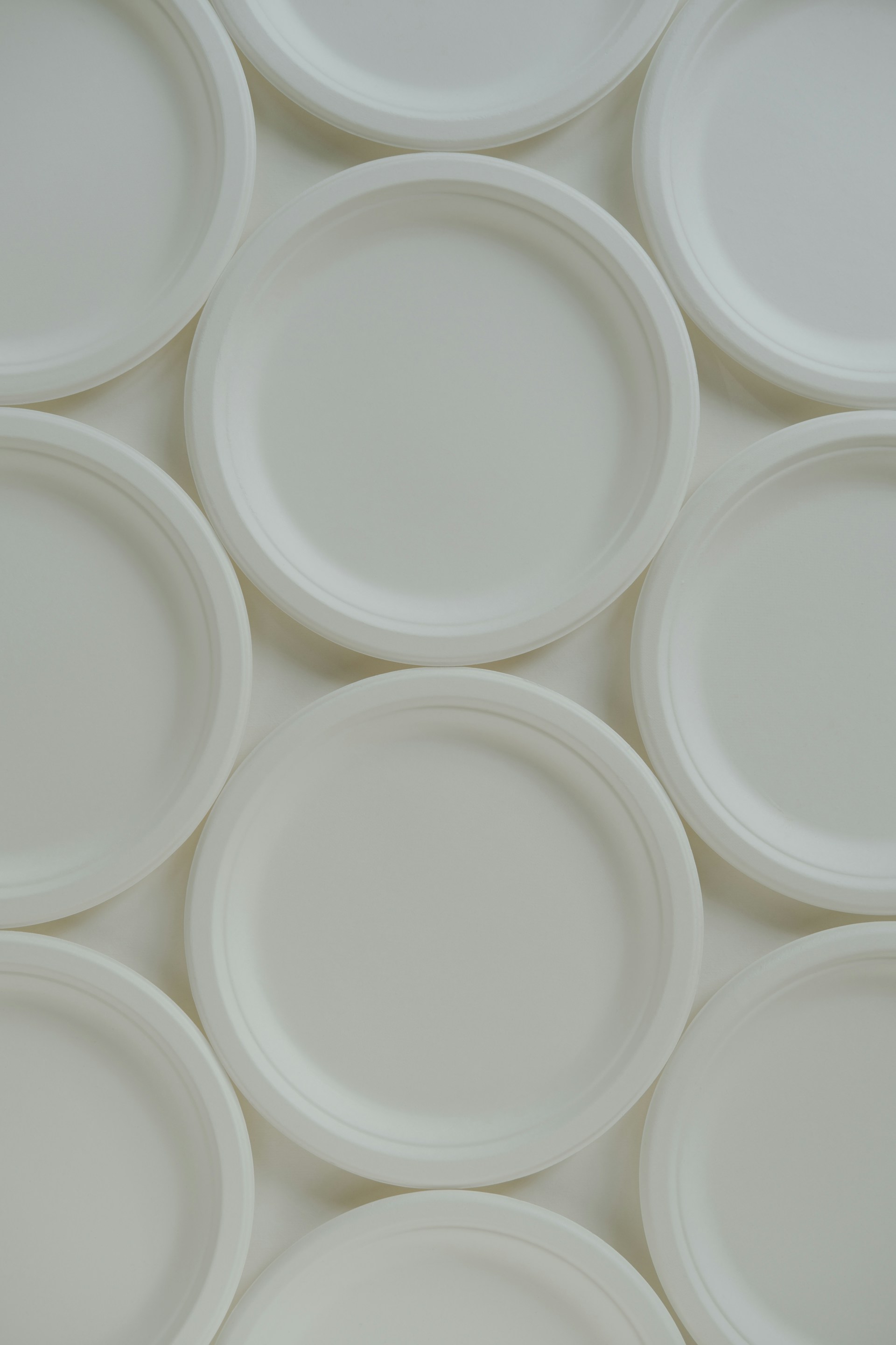 A group of white plates sitting on top of each other