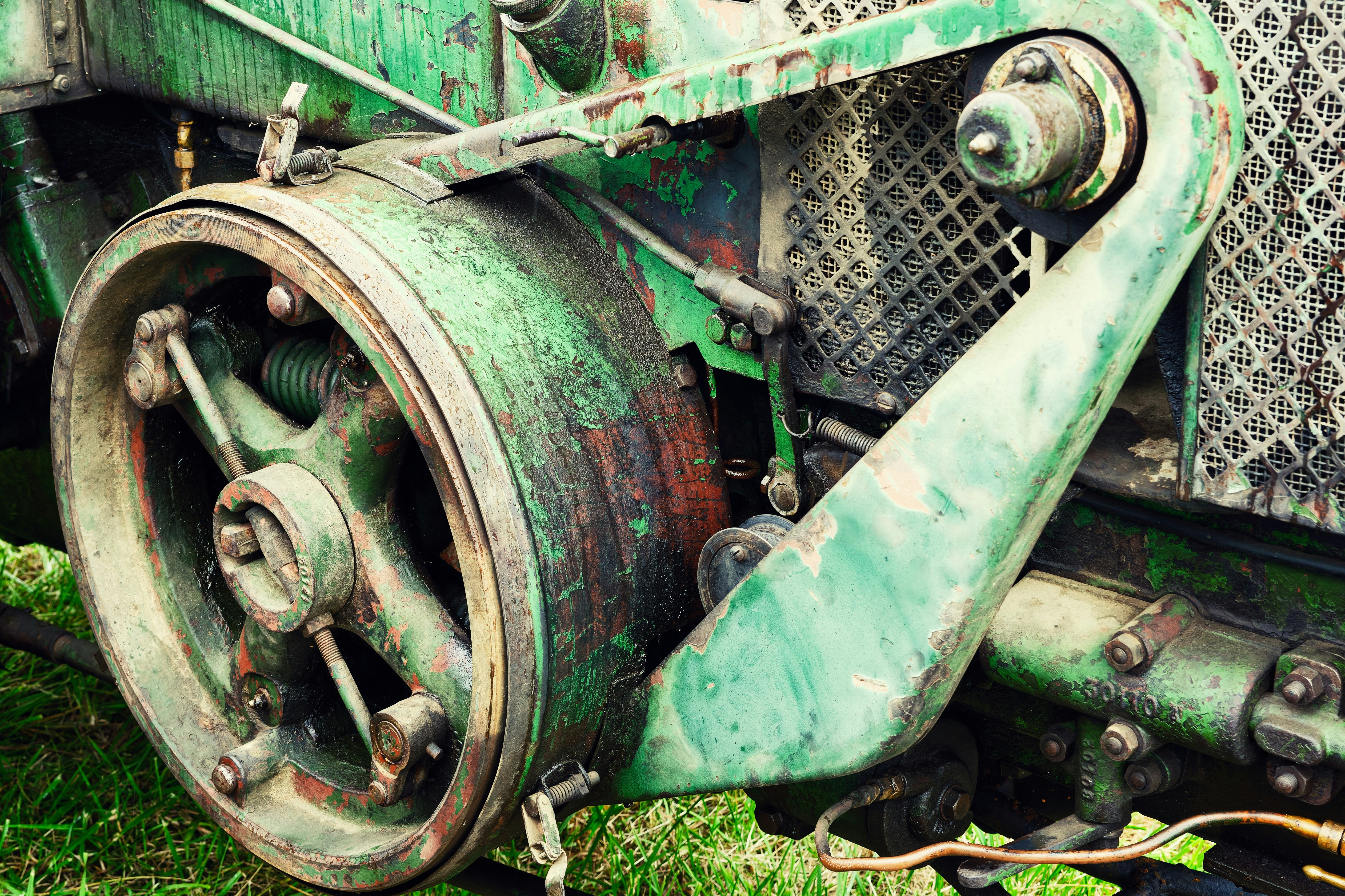 A close up of an old train on the grass