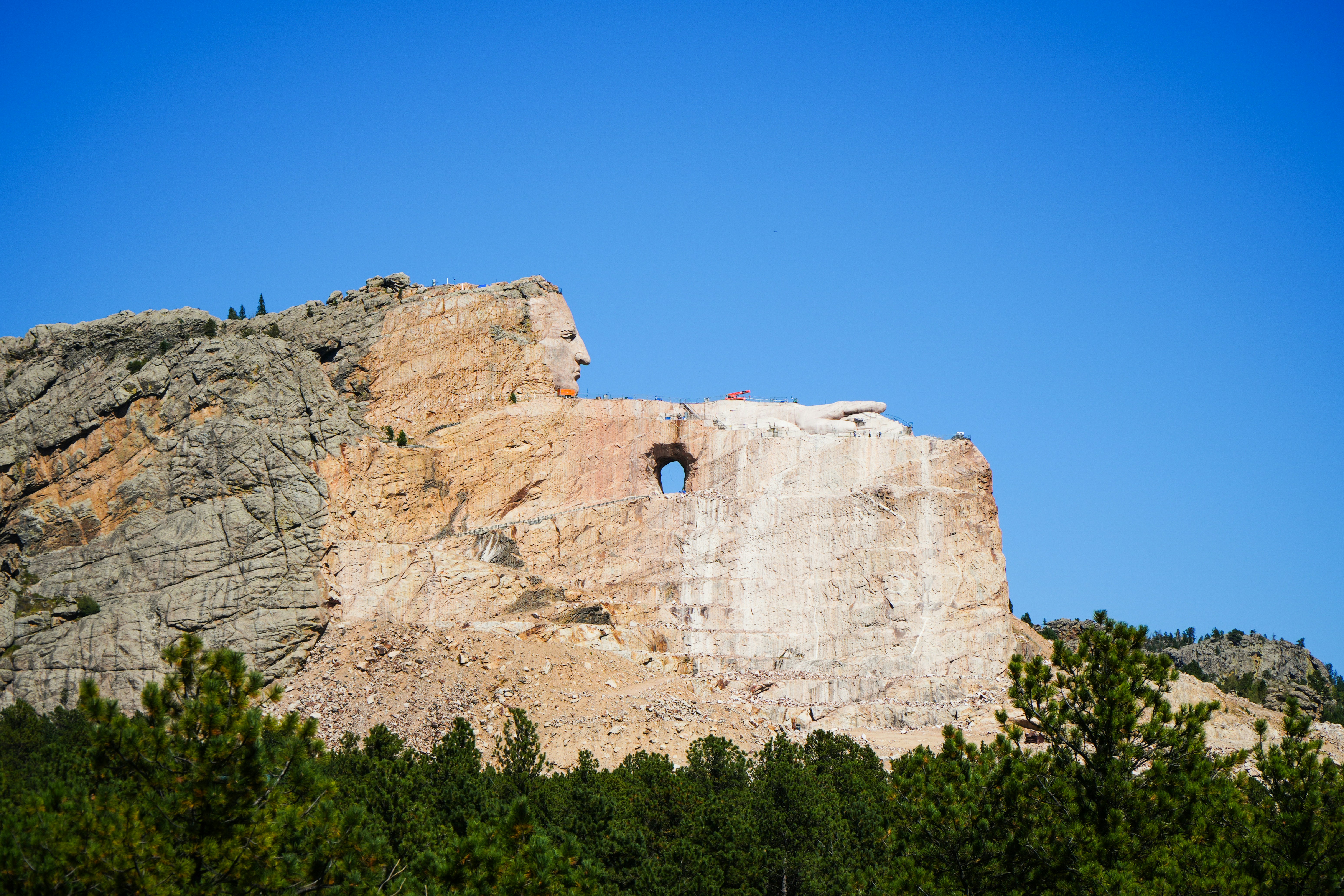 A rock formation with a window in the middle of it, 