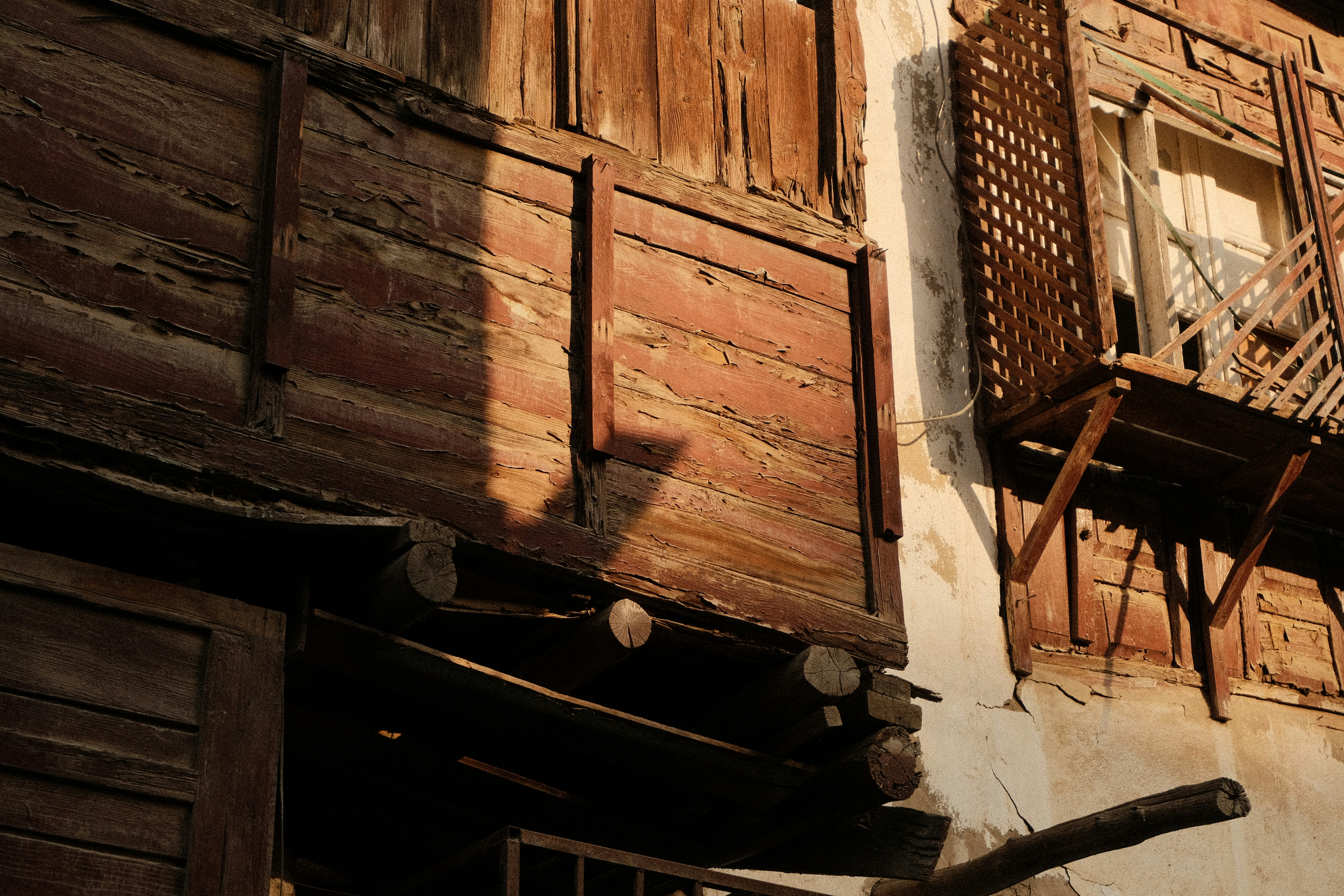 An old building with wooden balconies and shutters