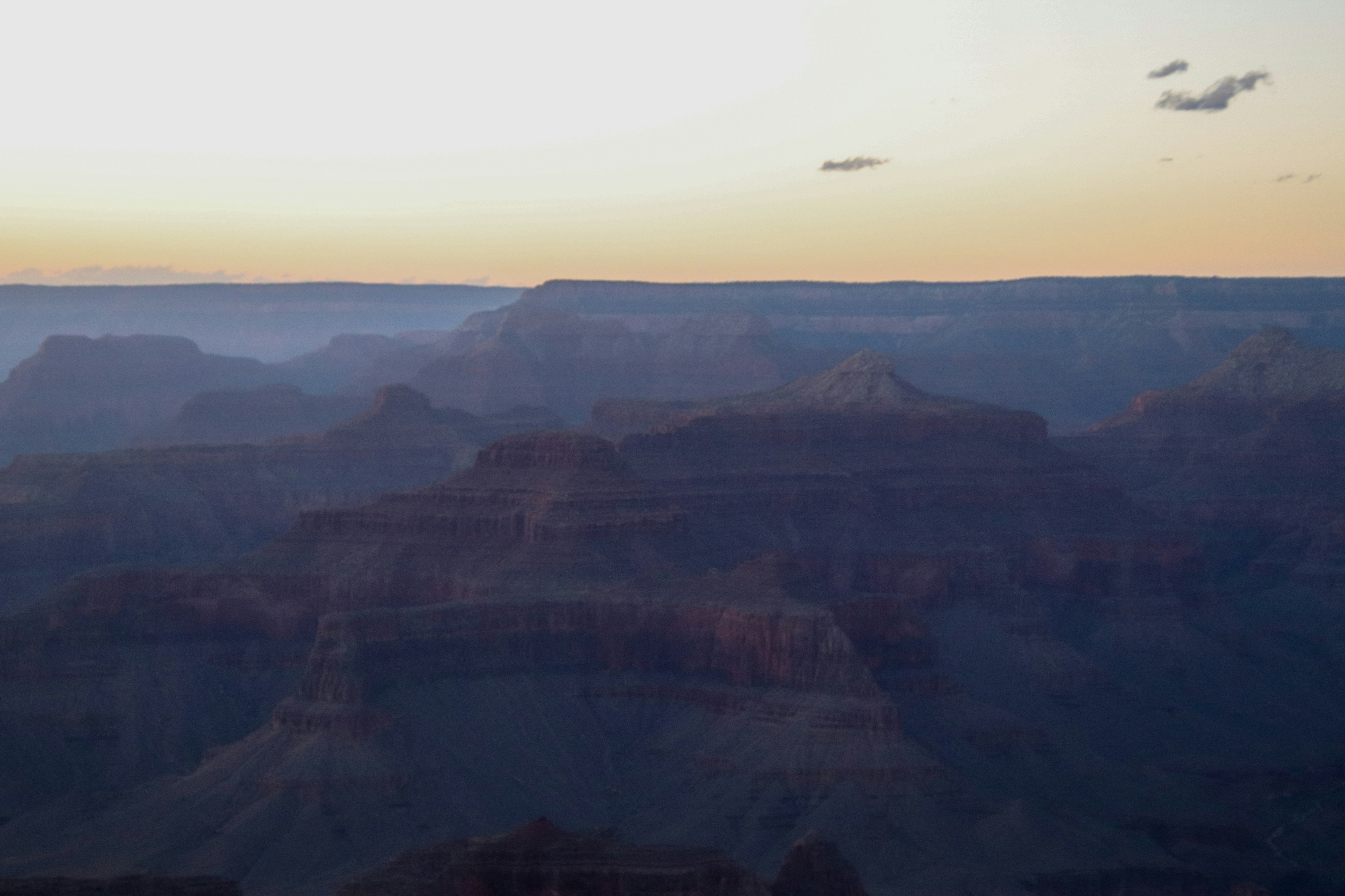 The sun is setting over the grand canyon, 