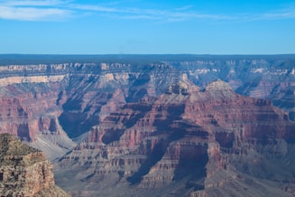 A man standing on the edge of a cliff
