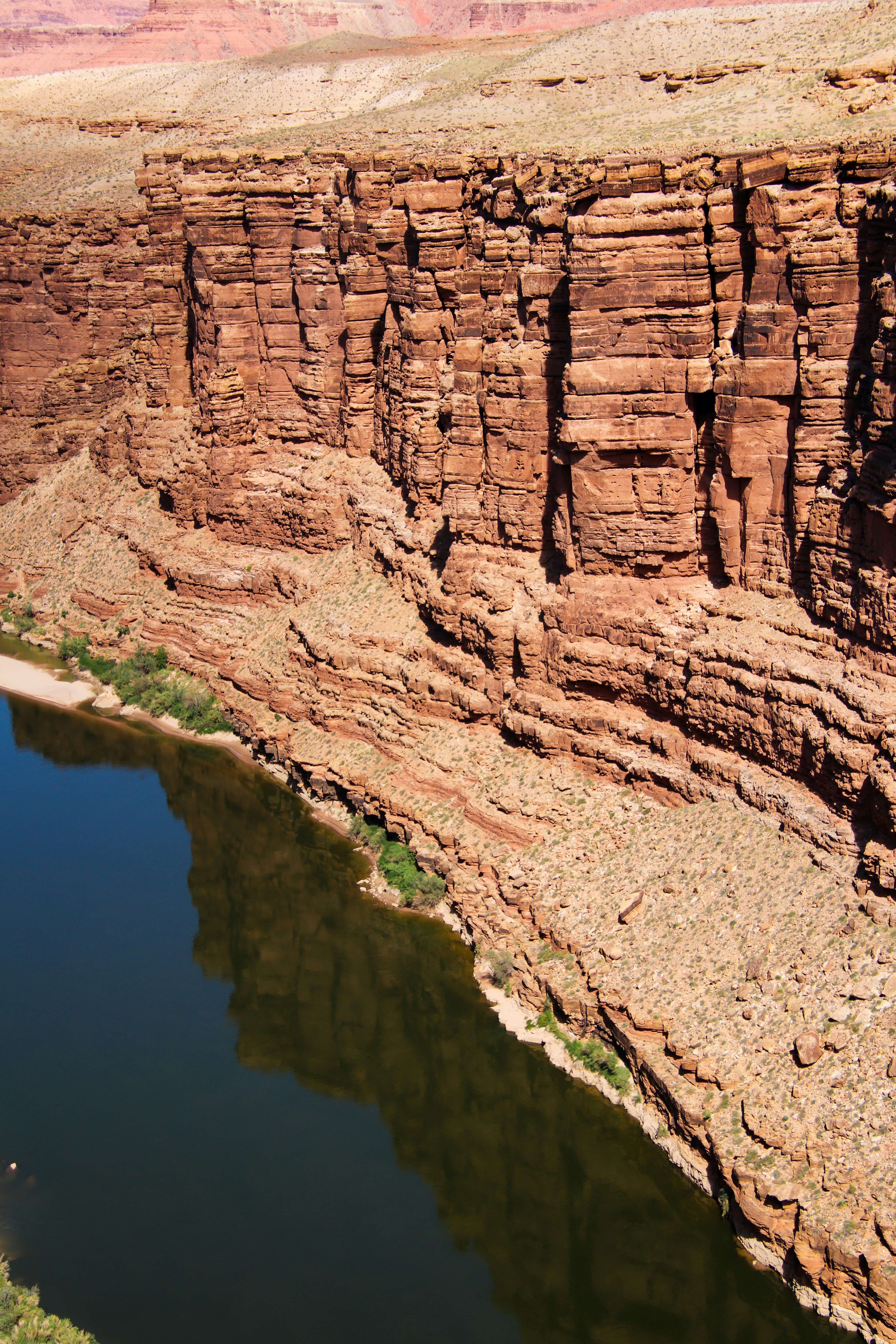 A large body of water near a cliff