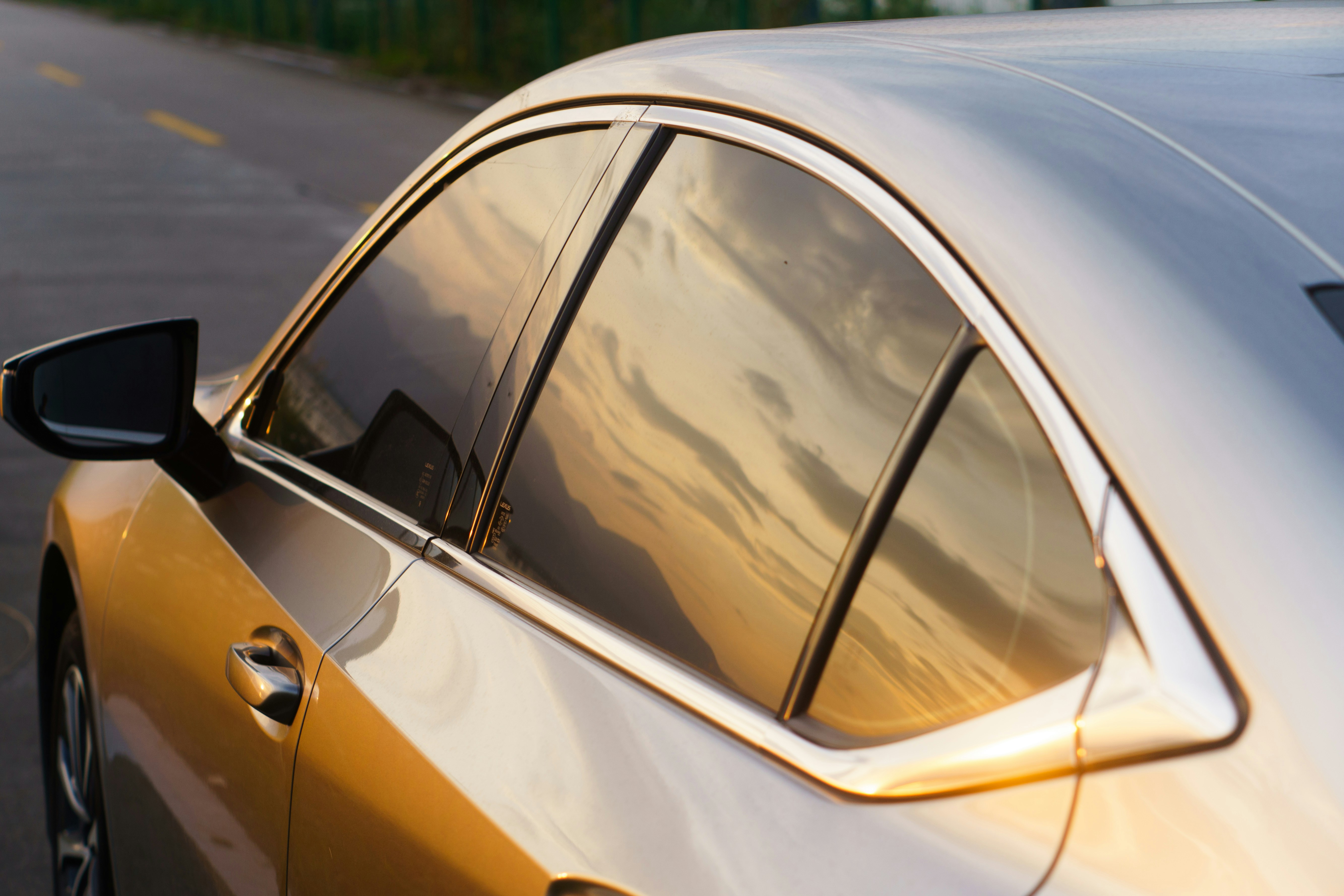 A silver car parked on the side of the road