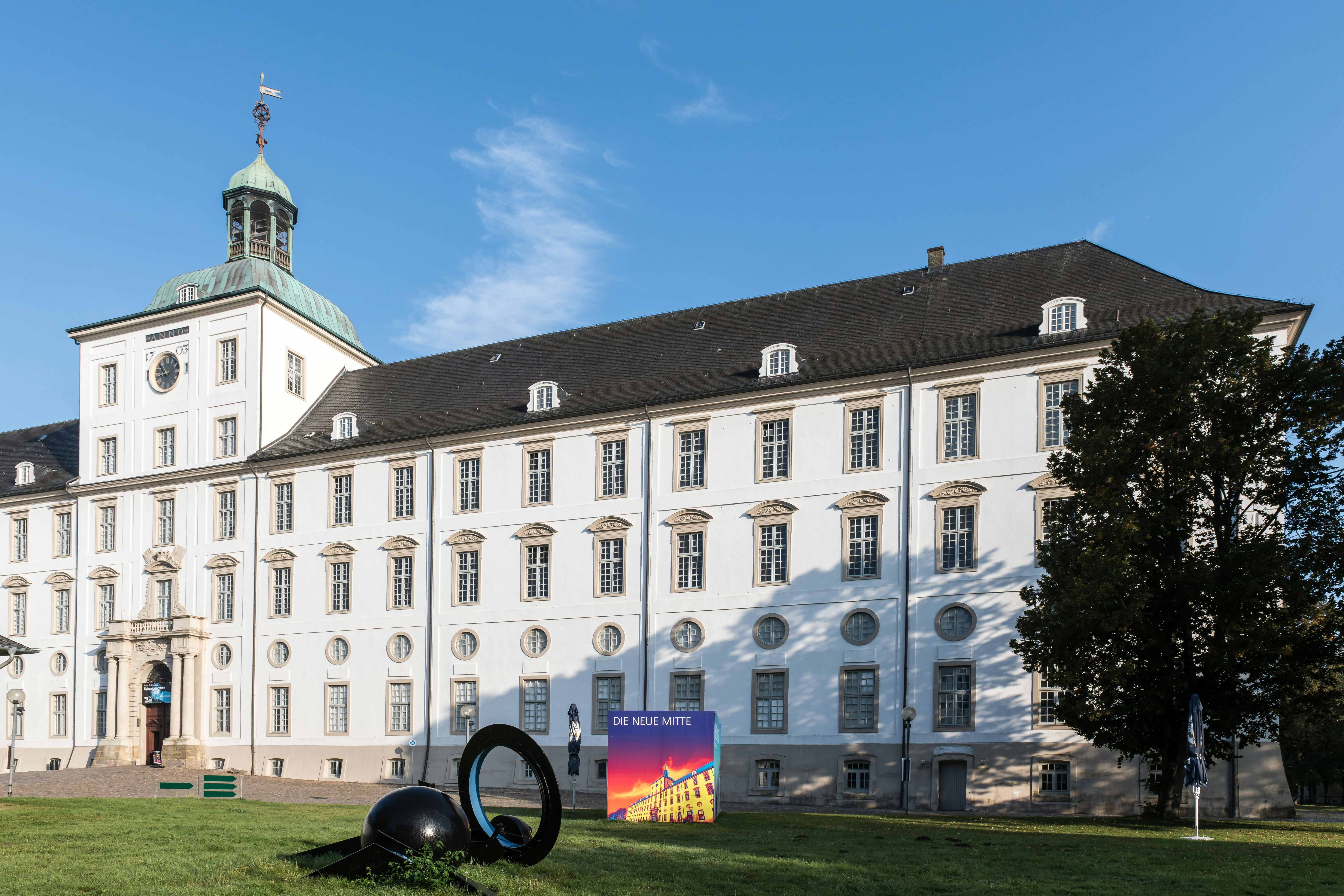 A large white building with a clock tower