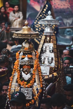A large group of people standing around a shrine