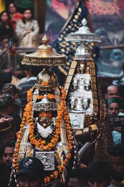 A large group of people standing around a shrine