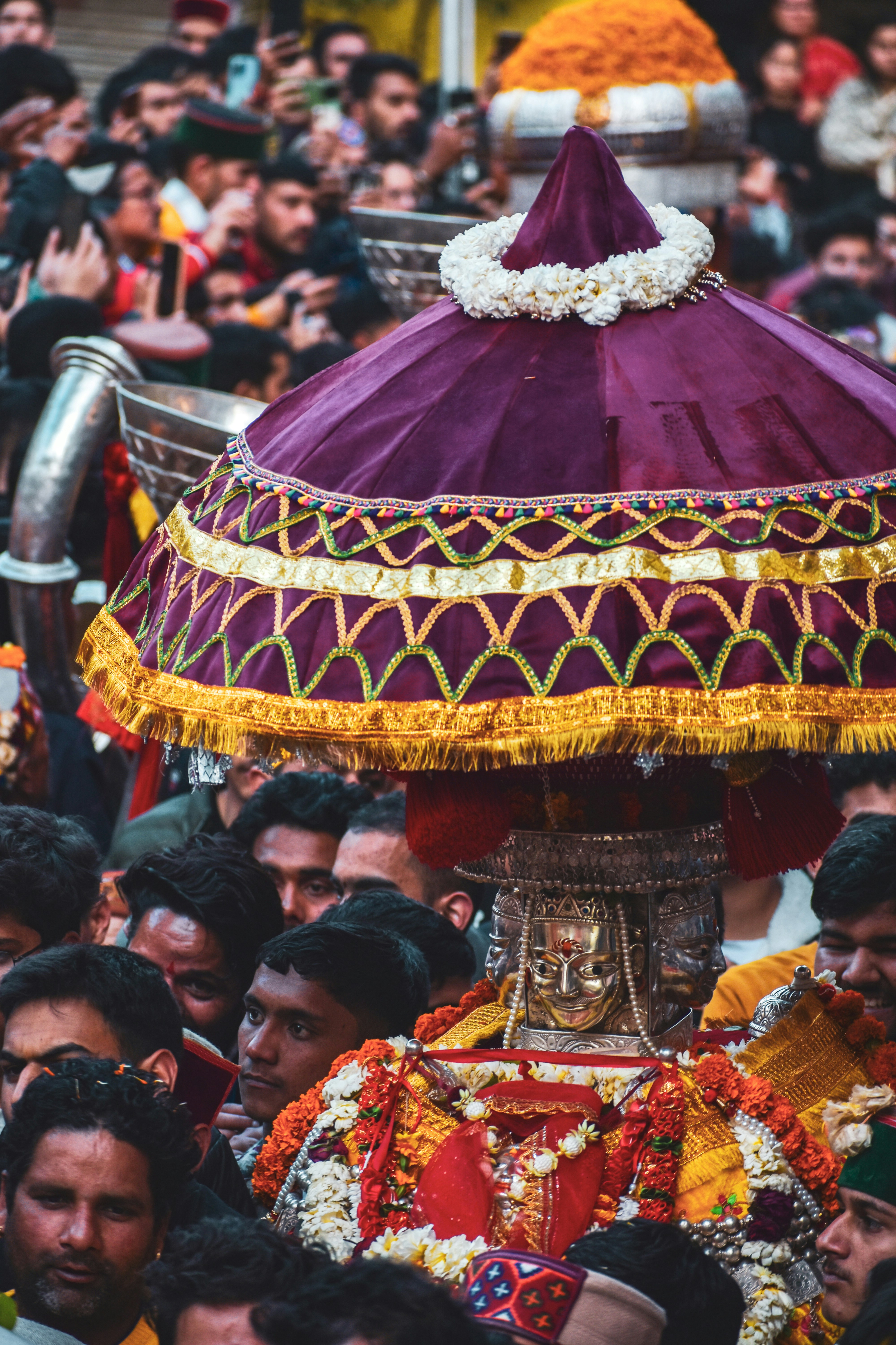 A large group of people standing around a man in a costume