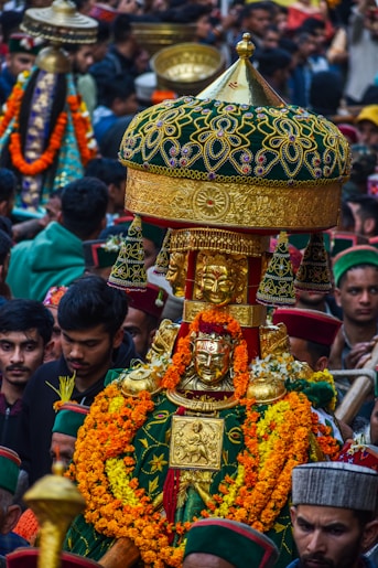 A large group of people standing around a shrine