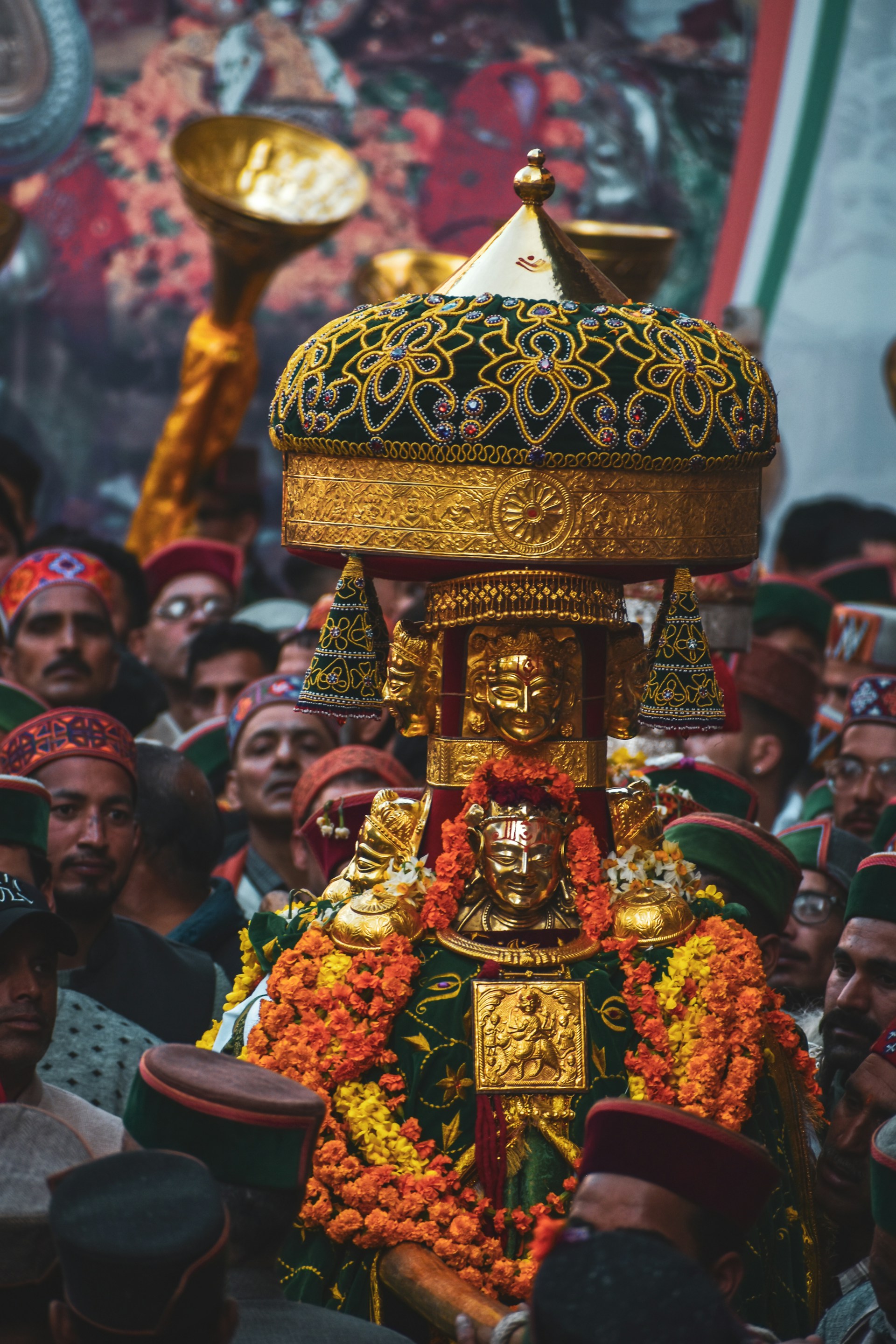 A large group of people standing around a shrine