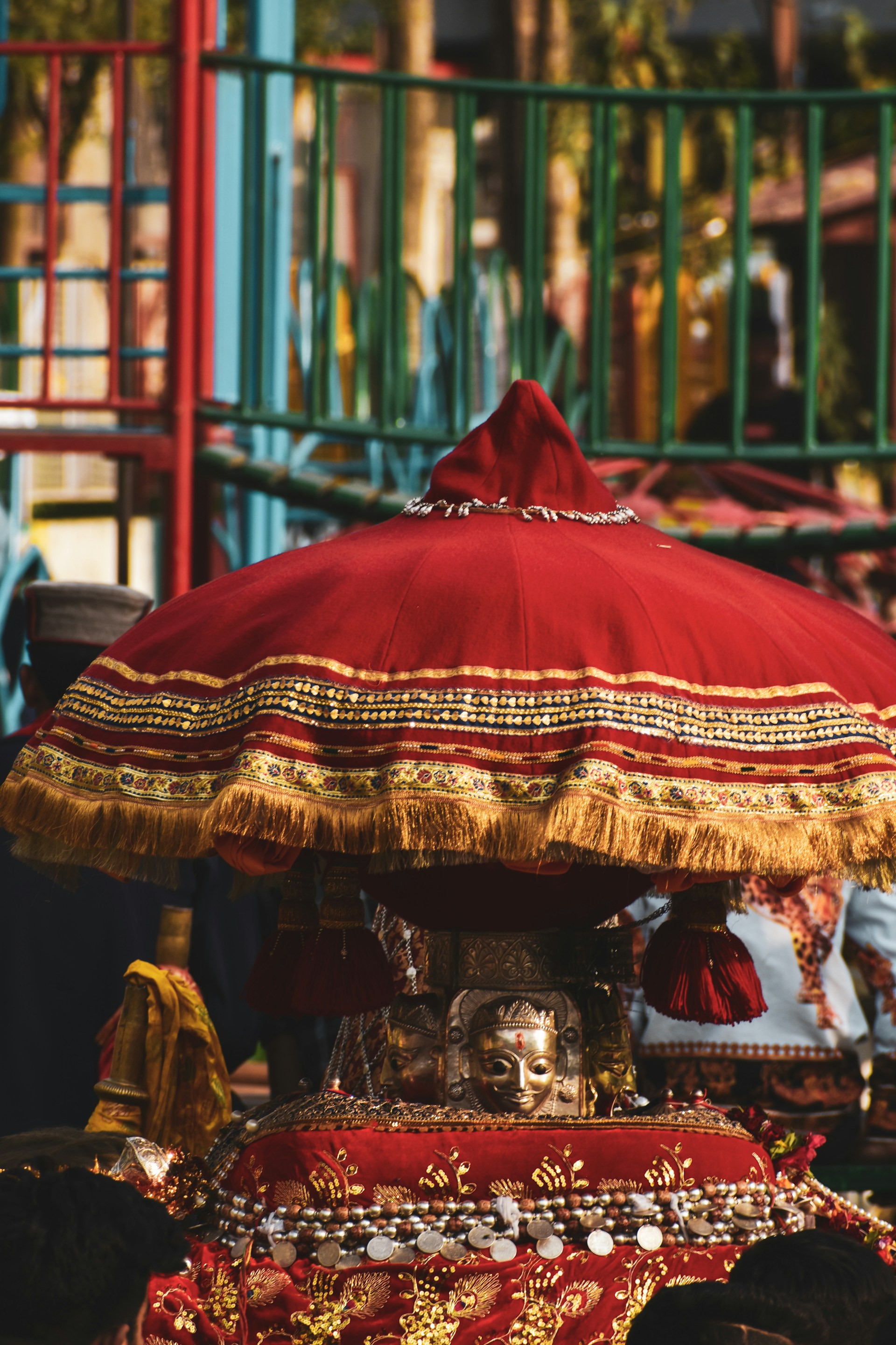 A red and gold umbrella sitting on top of a table