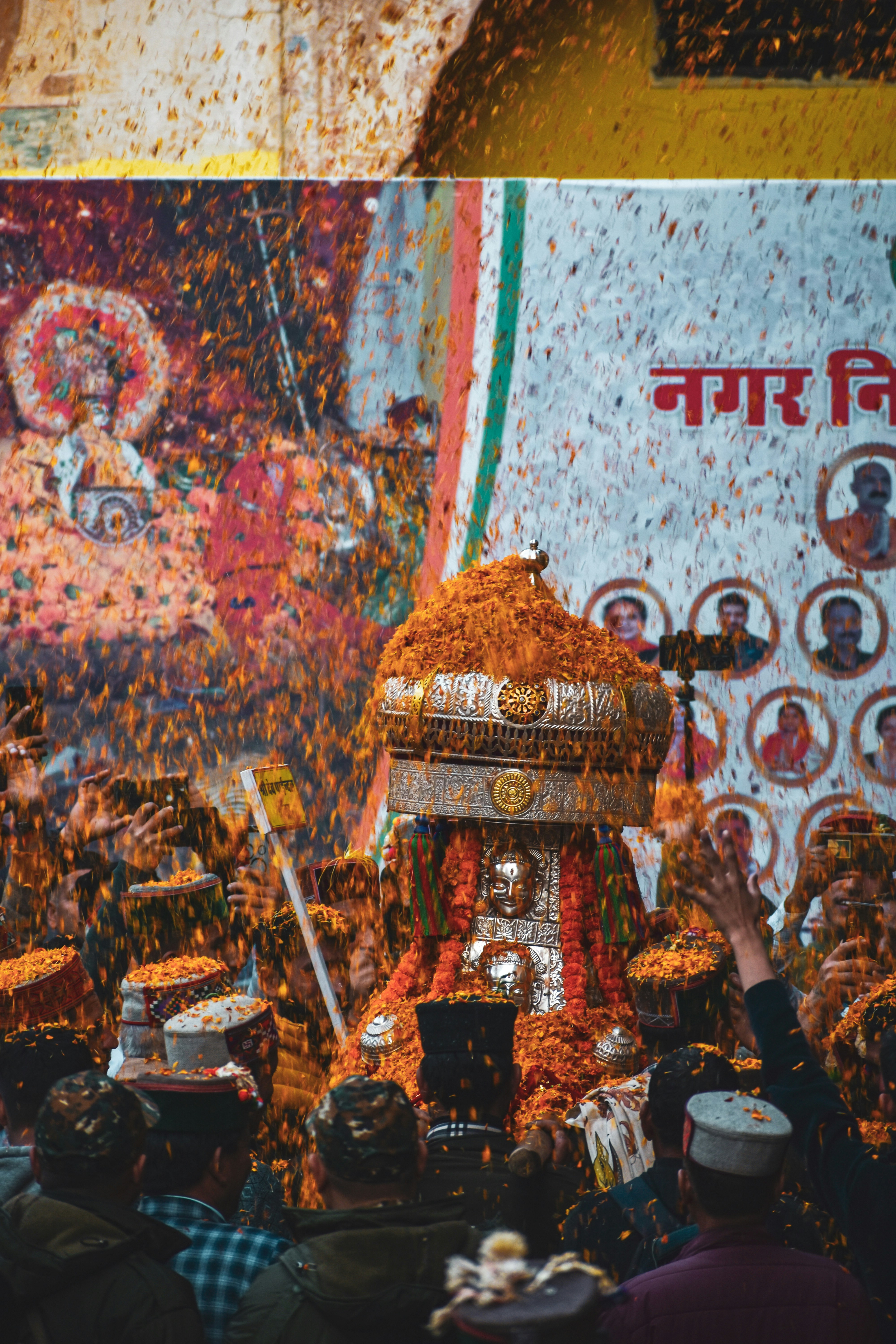 A group of people standing around a shrine