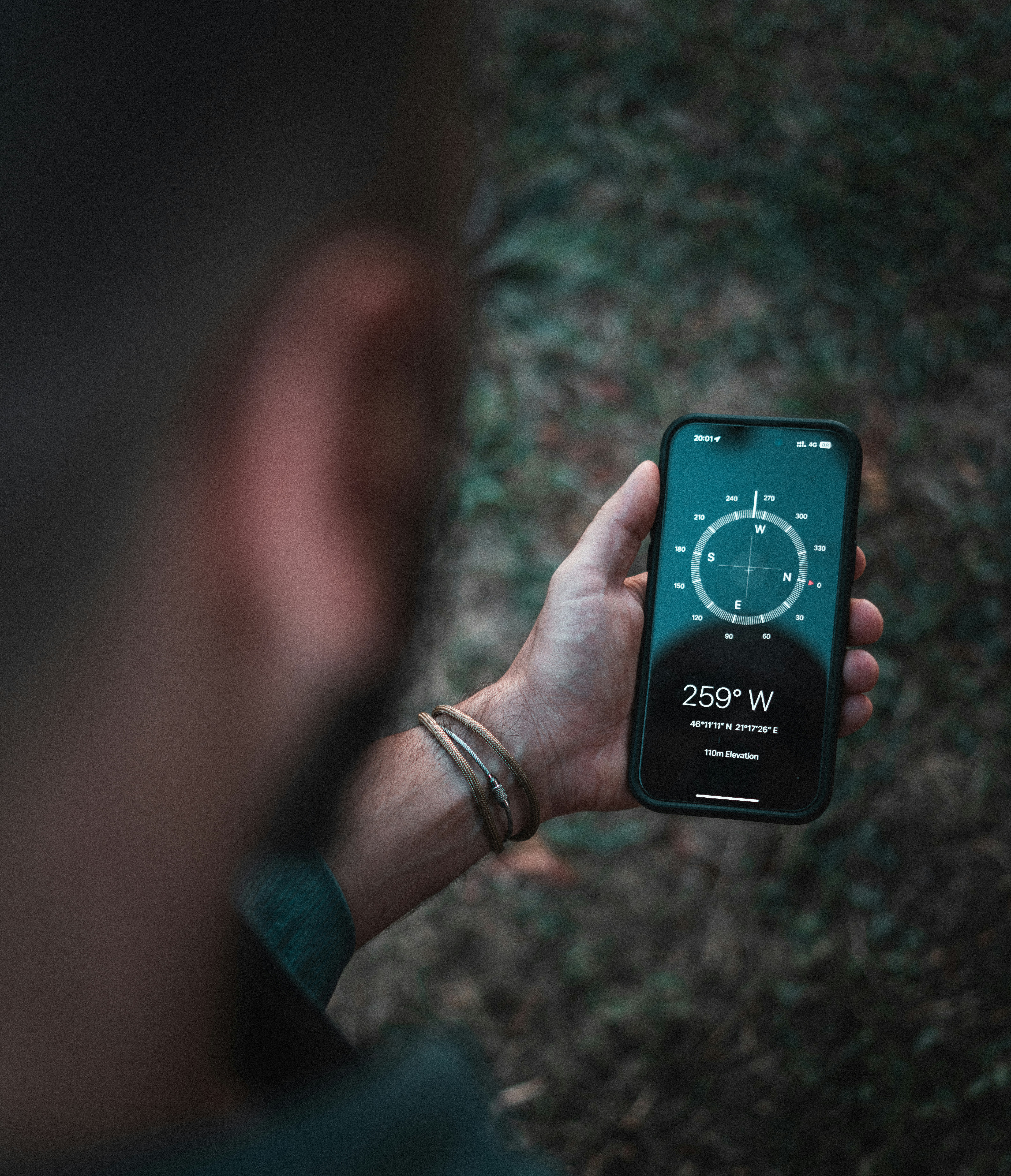 A person holding a cell phone in their hand