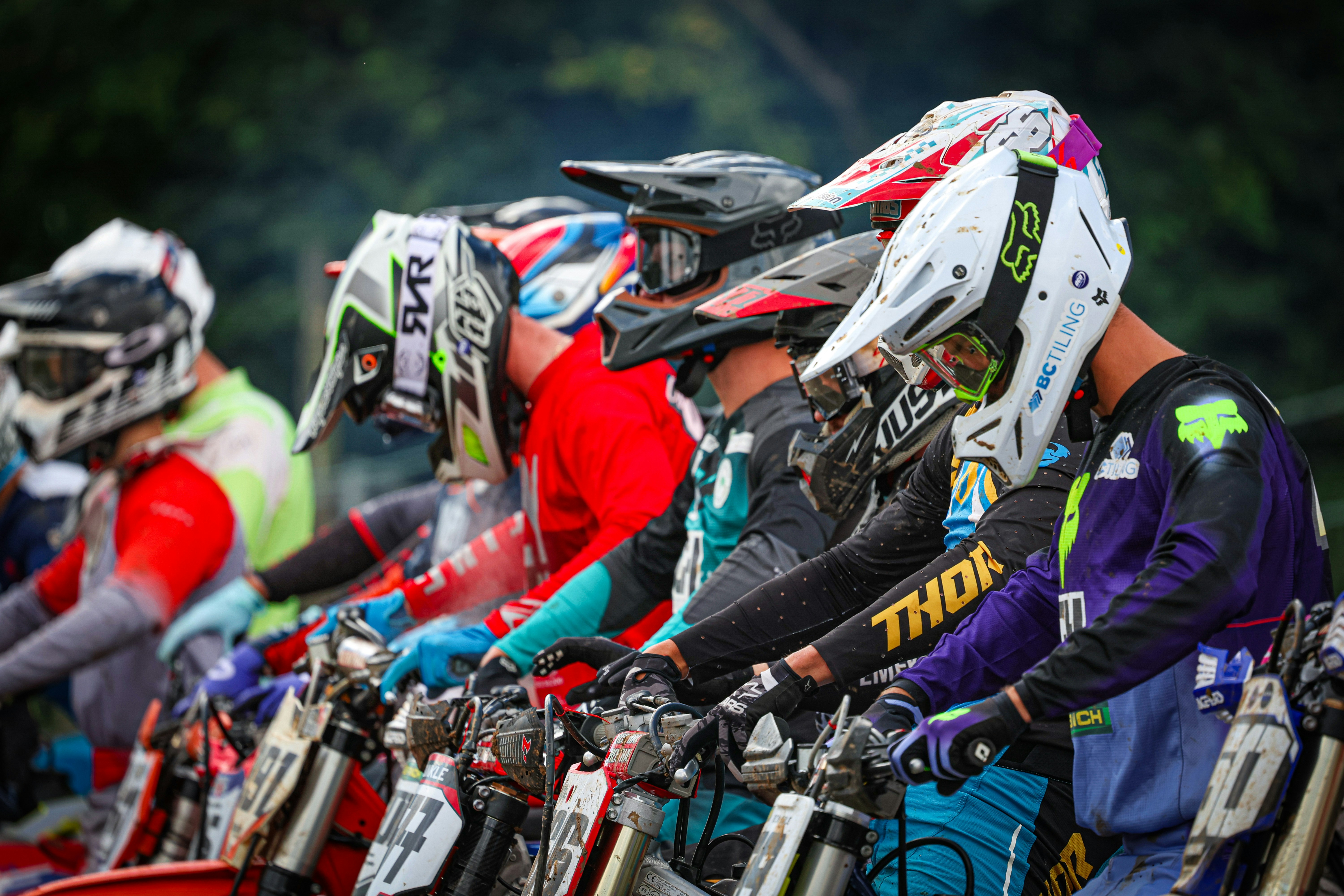 A group of bikers lined up in a row