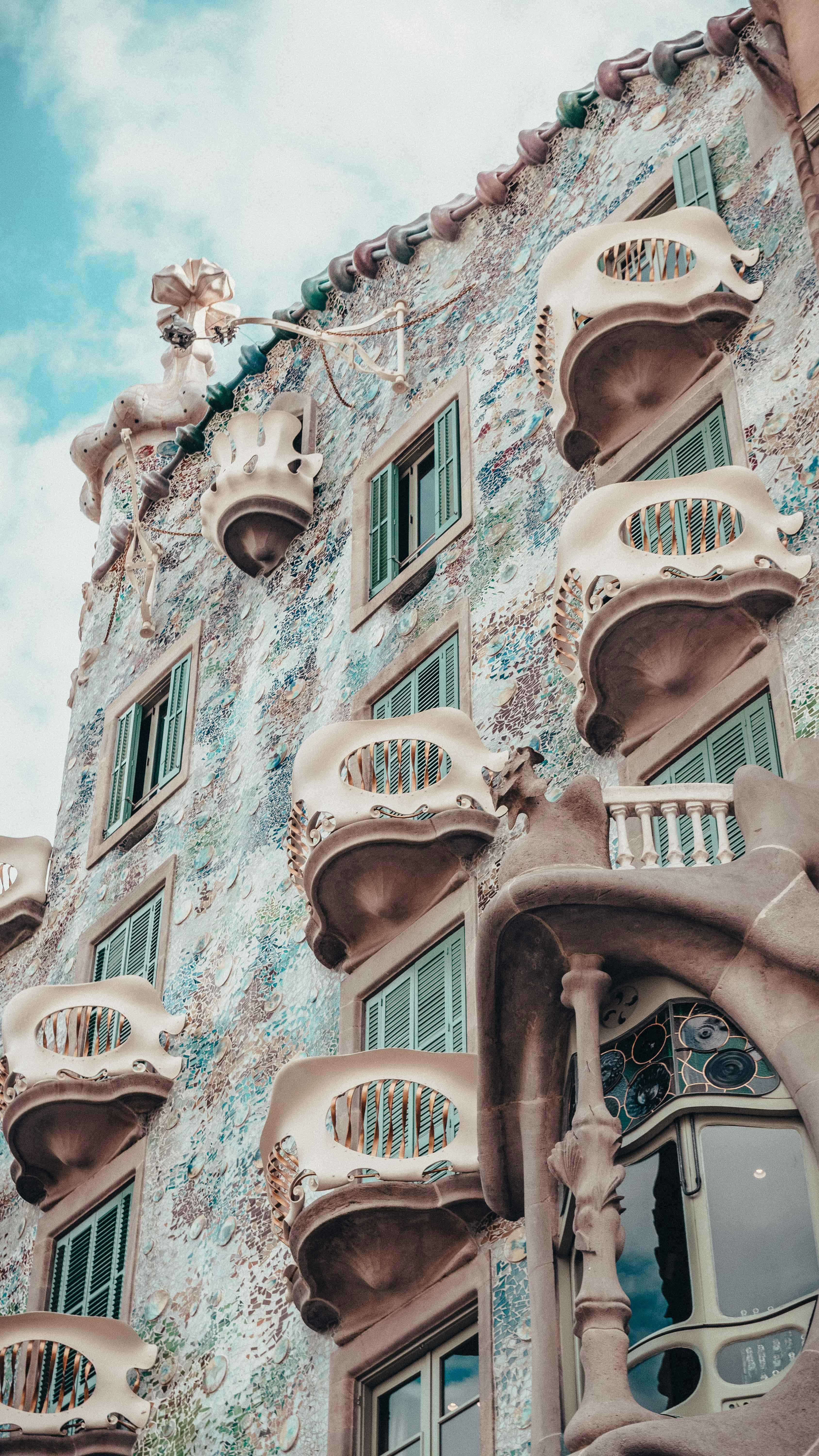 A tall building with many windows and balconies