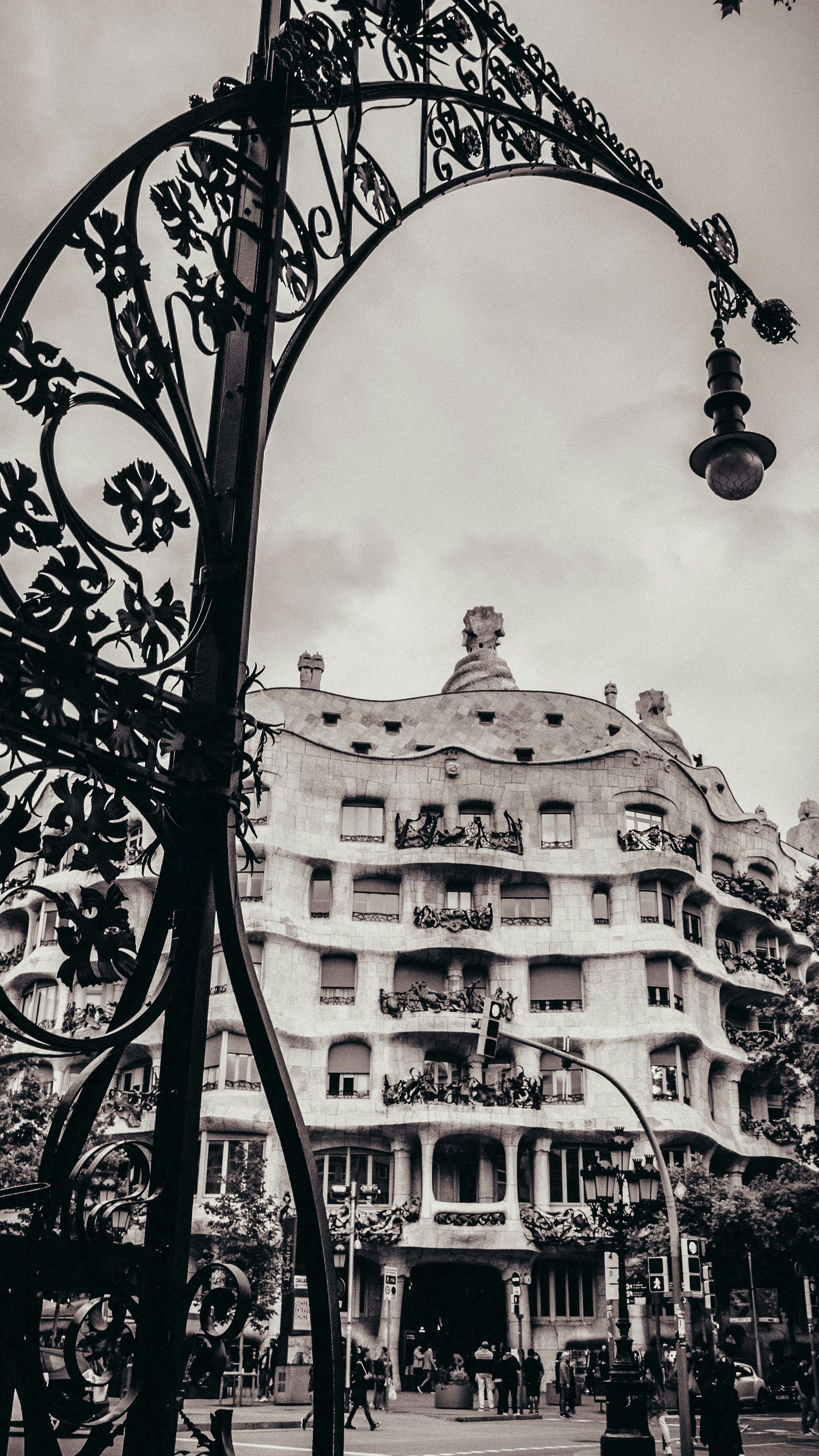 A black and white photo of a street light