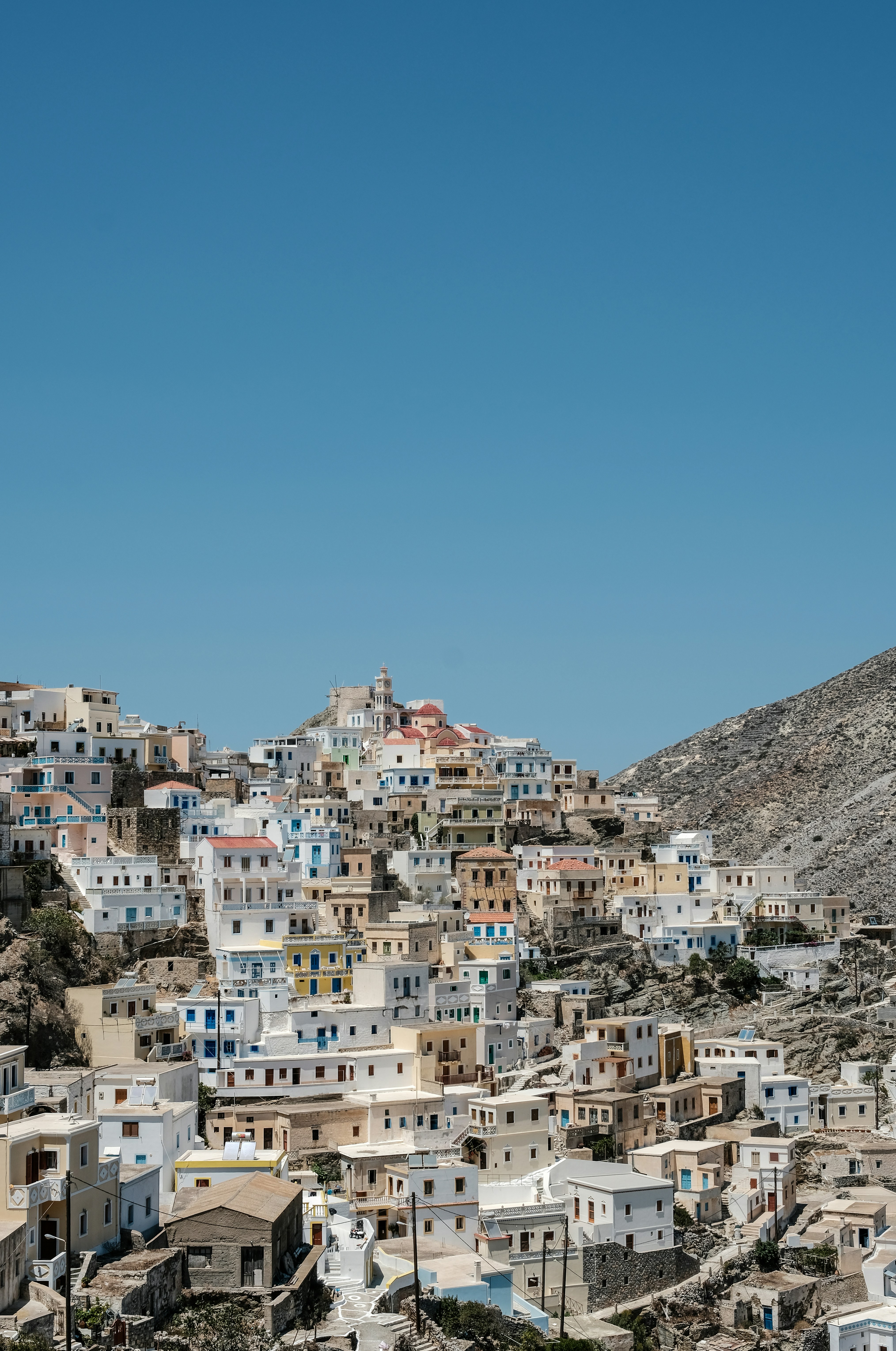A view of a city with a mountain in the background