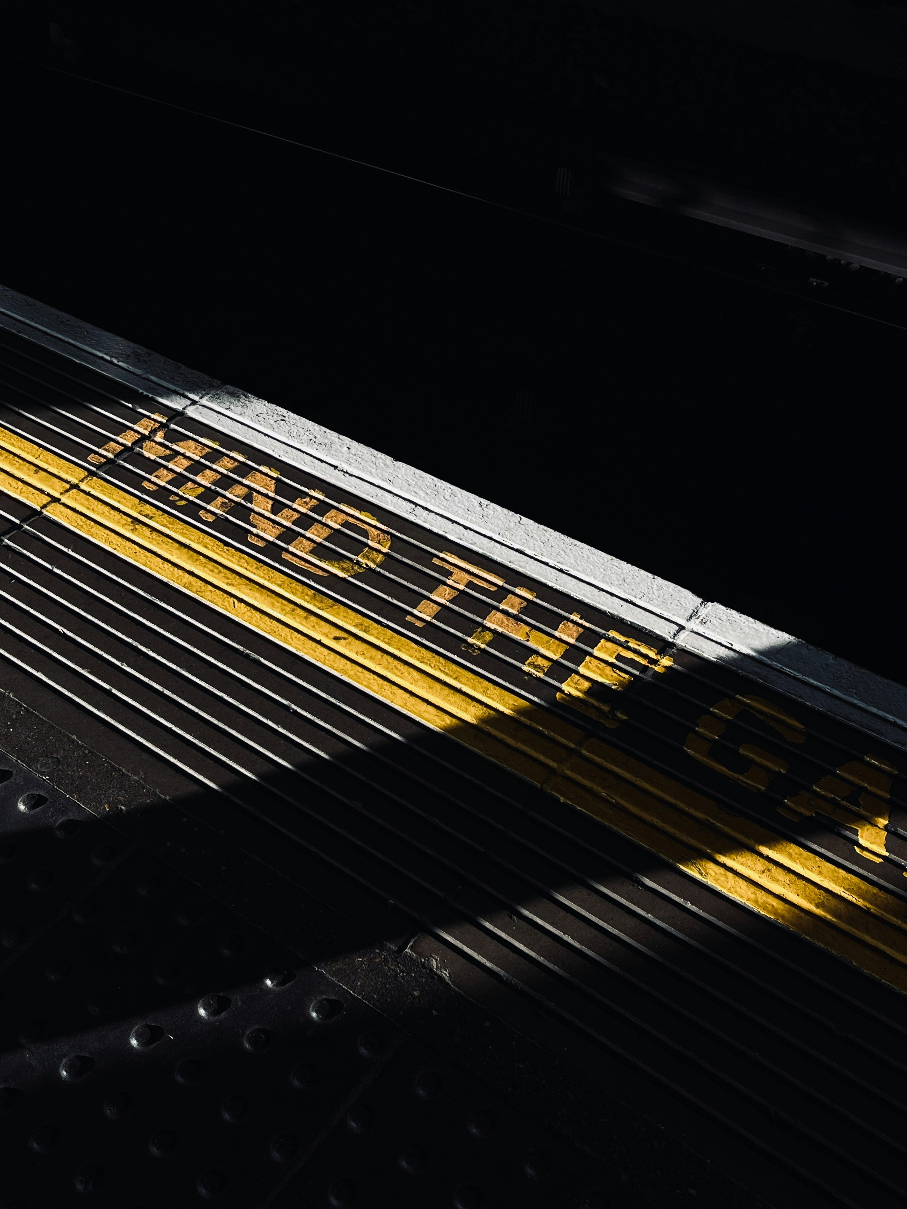A close up of a yellow and black train track