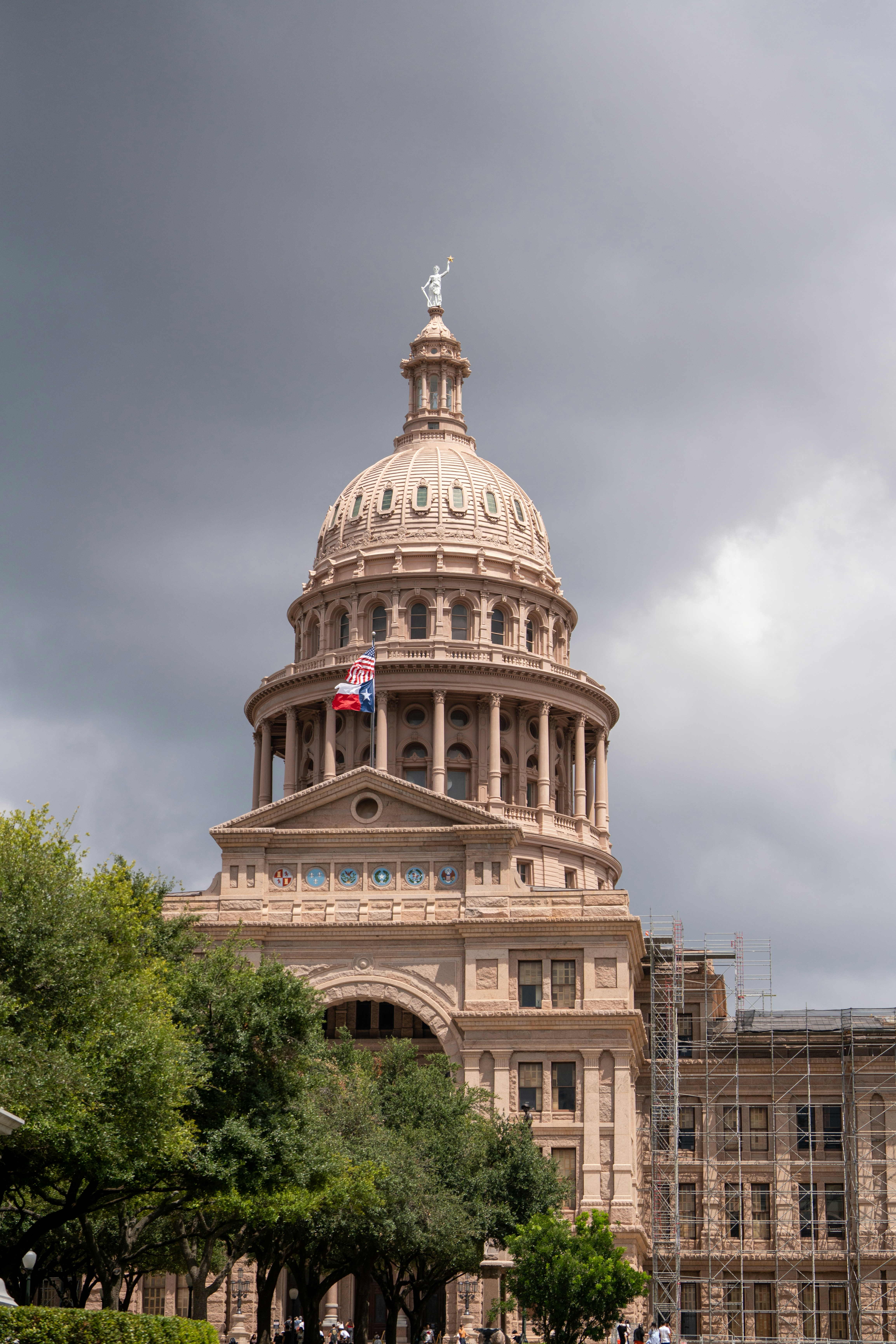 A large building with a flag on top of it