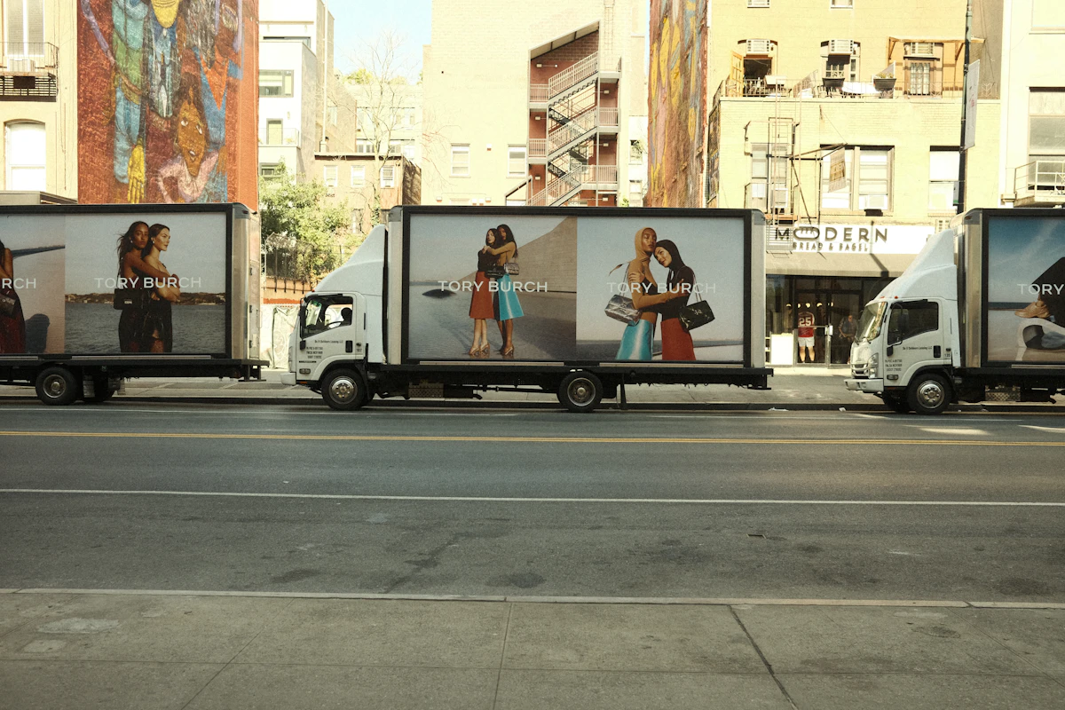 A line of delivery trucks parked side by side