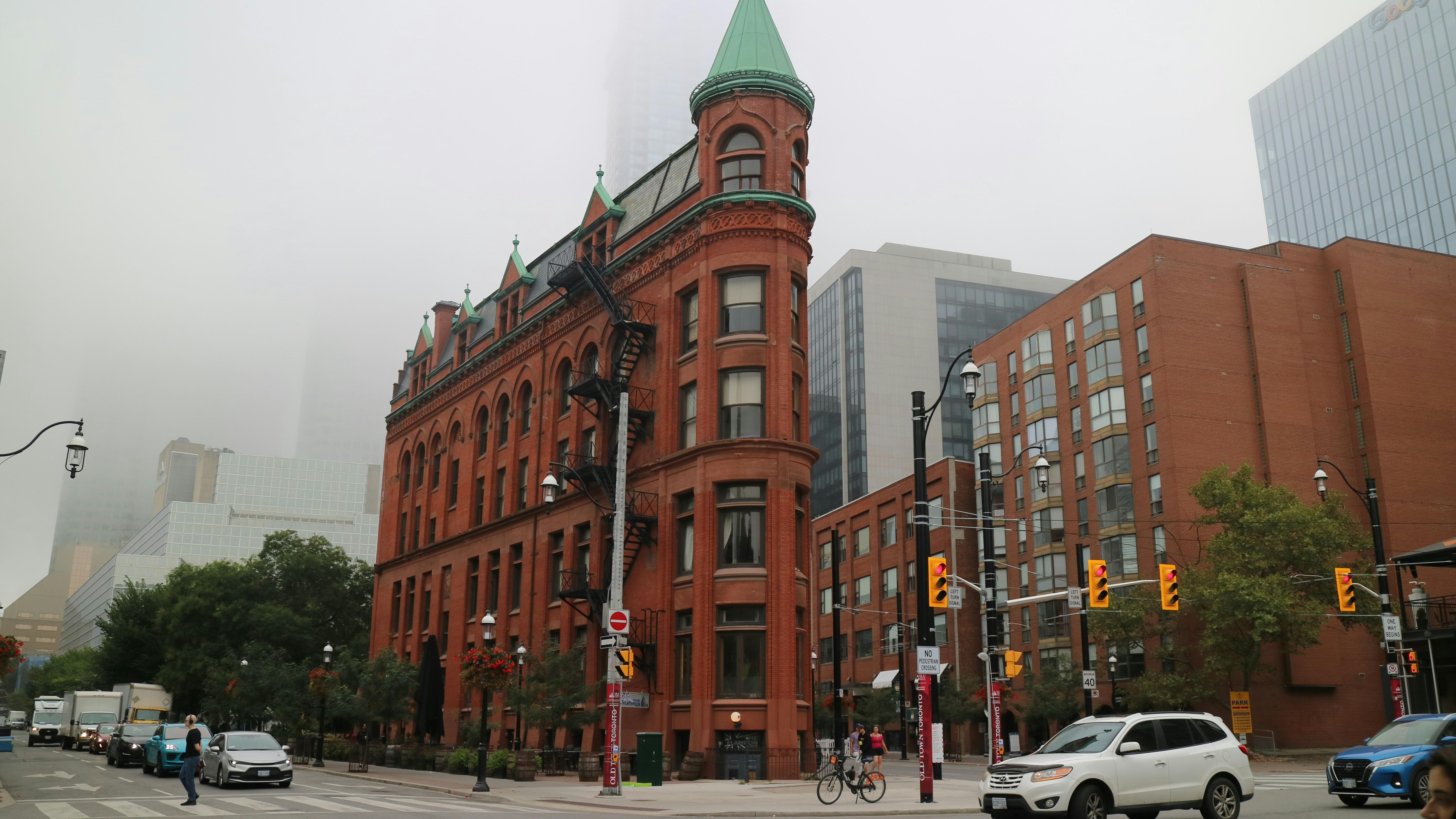 A large red building with a green steeple on top