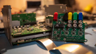 A close up of a computer motherboard and a mouse