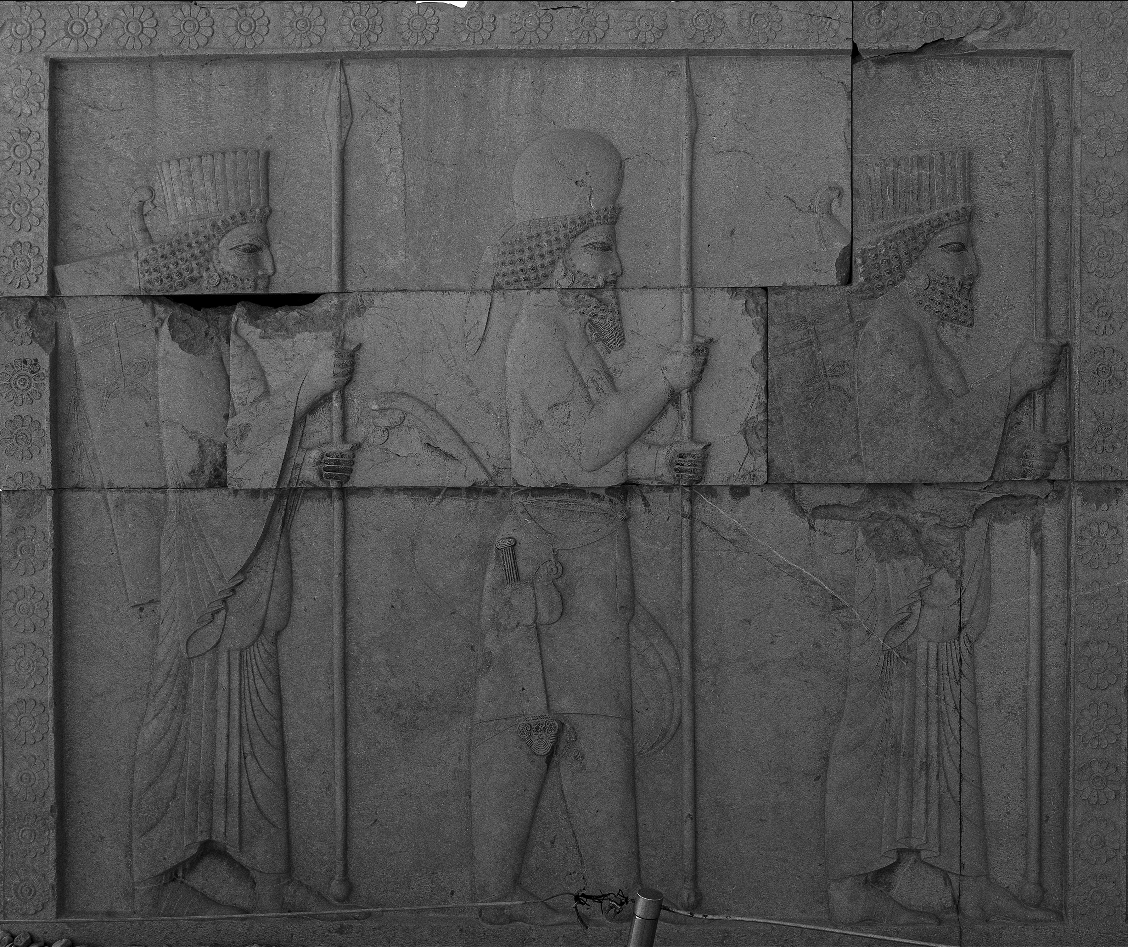 A black and white photo of a stone wall