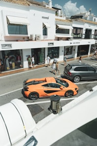 A group of cars parked on the side of a road