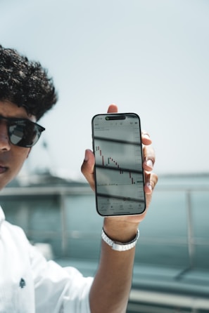 A man holding a cell phone in his hand