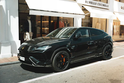 A black car parked on the side of the road