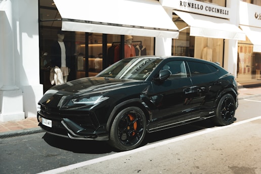 A black car parked on the side of the road