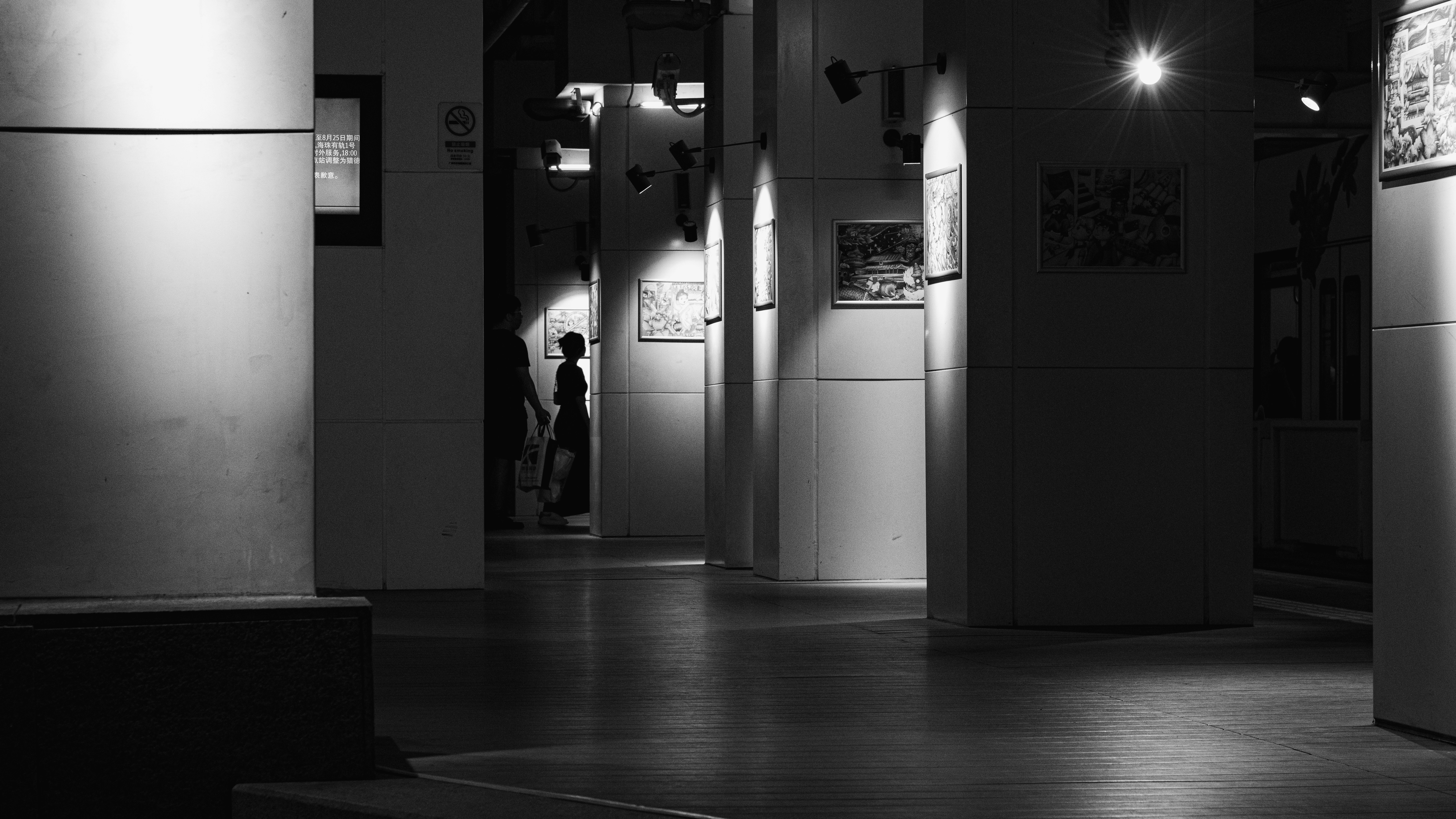 A black and white photo of a hallway