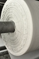 A roll of white paper sitting on top of a machine